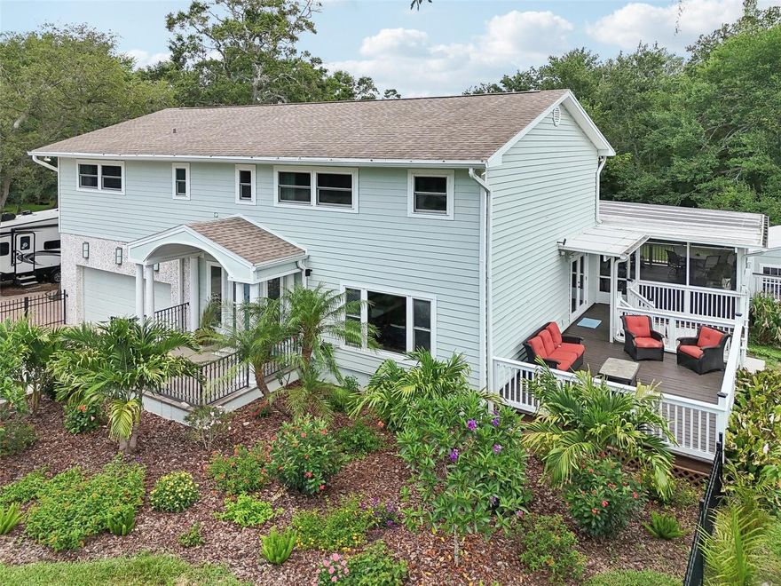 Live in the heart of Safety Harbor and experience an extraordinary blend of privacy, luxury, and natural beauty. This exceptional, one-of-a-kind property spans nine full lots (owner purchased additional land to for a total of 1.6 acres) and directly backs to Folly Farm Nature Preserve, a peaceful, 10-acre urban sanctuary—providing a rare sense of space, seclusion, and connection to nature just steps from downtown.

The 4-bedroom, 3-bathroom main home has been meticulously remodeled from top to bottom, showcasing modern elegance, thoughtful upgrades, and high-quality craftsmanship throughout. The chef’s kitchen features high-end stainless steel appliances, a natural gas range, refrigerator with dual icemakers, reverse osmosis water filtration, and sleek countertops. Additional upgrades include a natural gas tankless water heater, custom Levolor remote-control blinds, updated lighting and flooring, and spacious open living areas that flow effortlessly for entertaining and daily comfort.

Step outside into your resort-style private oasis, designed for both relaxation and celebration. The heated saltwater pool and spa feature a Pebble Sheen finish, a fully automated self-cleaning system, and a 400k BTU gas heater for year-round enjoyment. The large screened-in lanai includes a fully equipped outdoor kitchen, making it the perfect space to host gatherings. The outdoor living continues with an open-air deck, gazebo overlooking the yard and preserve, 1.6 acres, a large fire pit area, and lush, mature landscaping—including 10 fruit-bearing trees and pollinator-friendly garden beds.

A versatile poolside building is ideal for a home gym, office, or creative studio, already wired and prepped for a mini-split A/C system. Additional features include a shallow well with a 10-zone irrigation system (offering cost-free watering), RV parking with electric hook-up, a garden shed, and ample room for expansion.

This unique property comes with no deed restrictions and no flood insurance required due to its high elevation—providing the kind of freedom and flexibility rarely found in the area. Whether you envision a private compound, a multi-generational estate, or wish to develop or sell off a few lots while keeping your sanctuary intact, the options are truly endless.

Located just half a mile from Safety Harbor’s vibrant downtown, which is golf cart friendly, you’ll enjoy easy access to charming shops, restaurants, art festivals, and community events like the weekly Farmers Market and Third Friday celebrations. Nearby parks such as Philippe Park and Safety Harbor City Park with waterfront trails, playgrounds, and extensive recreational amenities. Plus, you're just 15 miles from Tampa International Airport and 10 miles to Clearwater Beach, with convenient routes to Tampa, Clearwater, and St. Petersburg.

Don’t miss this rare opportunity to own a private retreat in one of Tampa Bay’s most desirable communities. Whether you're looking for space to entertain, expand, invest, or simply unwind—this property delivers unmatched lifestyle, location, and potential.