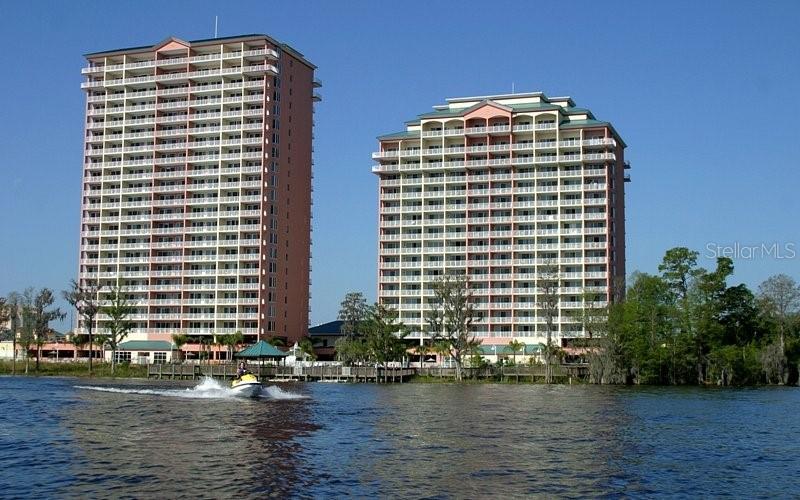 Handicap accessible vacation condo on the 4th floor overlooking the beautiful Lake Bryant. Investor opportunity to redecorate and furnish in your style. Spacious 1-bedroom, 2-bathroom water-view suite in the sought-after Blue Heron Beach Resort. This unit will comfortably accommodate a king-size bed in the bedroom, twin bunk beds in a hallway alcove, and a fold out sleeper sofa in the living area that sleeps 2. Enjoy beautiful sunrises from your private balcony overlooking the water. The resort’s shared balconies give nightly views of Disney’s fireworks. The suite also features an in-unit washer and dryer. Located just a few minutes to Disney, Universal, Sea World and I-Drive. This property offers fantastic resort amenities such as a large main pool, quieter secondary pool, children's wading pool, 10-person hot tub,
two fitness centers, video arcade, tiki bar, and a scenic boardwalk through the cypress and pine trees that extends over the water. Many restaurants and shopping are close by! Maximum of 180 days each year for any occupation of the unit. Blue Heron Beach is zoned for short term rentals only. You will be one of few Units that proudly offers a Handicap Accessible alternative. It is certain to attract many more travelers needs.