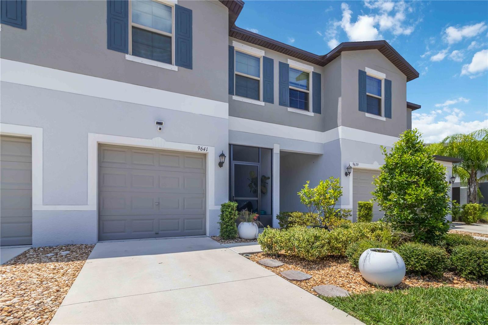 Welcome to this exceptional two-story townhouse that perfectly blends modern comfort with thoughtful design! Built in 2021 and meticulously maintained, this move-in ready home offers three spacious bedrooms and two and a half bathrooms across 1,701 square feet of well-planned living space.
Step inside to discover soaring nine-foot ceilings and an open floor plan that seamlessly connects the great room's living and dining areas. The heart of the home features a stunning kitchen with crisp white cabinetry, elegant granite countertops, stainless steel appliances, and a convenient pantry closet. Recessed lighting and tile flooring throughout the first floor create a clean, contemporary atmosphere.
Upstairs, you'll find three generously sized bedrooms, each equipped with ceiling fans and window treatments. The primary bedroom serves as your personal retreat with an ensuite bathroom featuring a double vanity, spacious walk-in shower with glass doors, and an organized walk-in closet. A dedicated laundry room accommodates full-size appliances for added convenience.
The screened lanai with brick pavers provides the perfect spot for morning coffee while overlooking peaceful courtyard views. Additional thoughtful touches include a decorative glass front door insert, double-pane windows, hurricane shutters, and a screened front entrance.
Located in the desirable Cypress Creek community, you'll enjoy low homeowners association fees that include cable, internet, community pool access, grounds maintenance, and exterior maintenance. This townhouse combines affordability with quality living in one of Florida's most sought-after neighborhoods, where convenience meets tranquility.