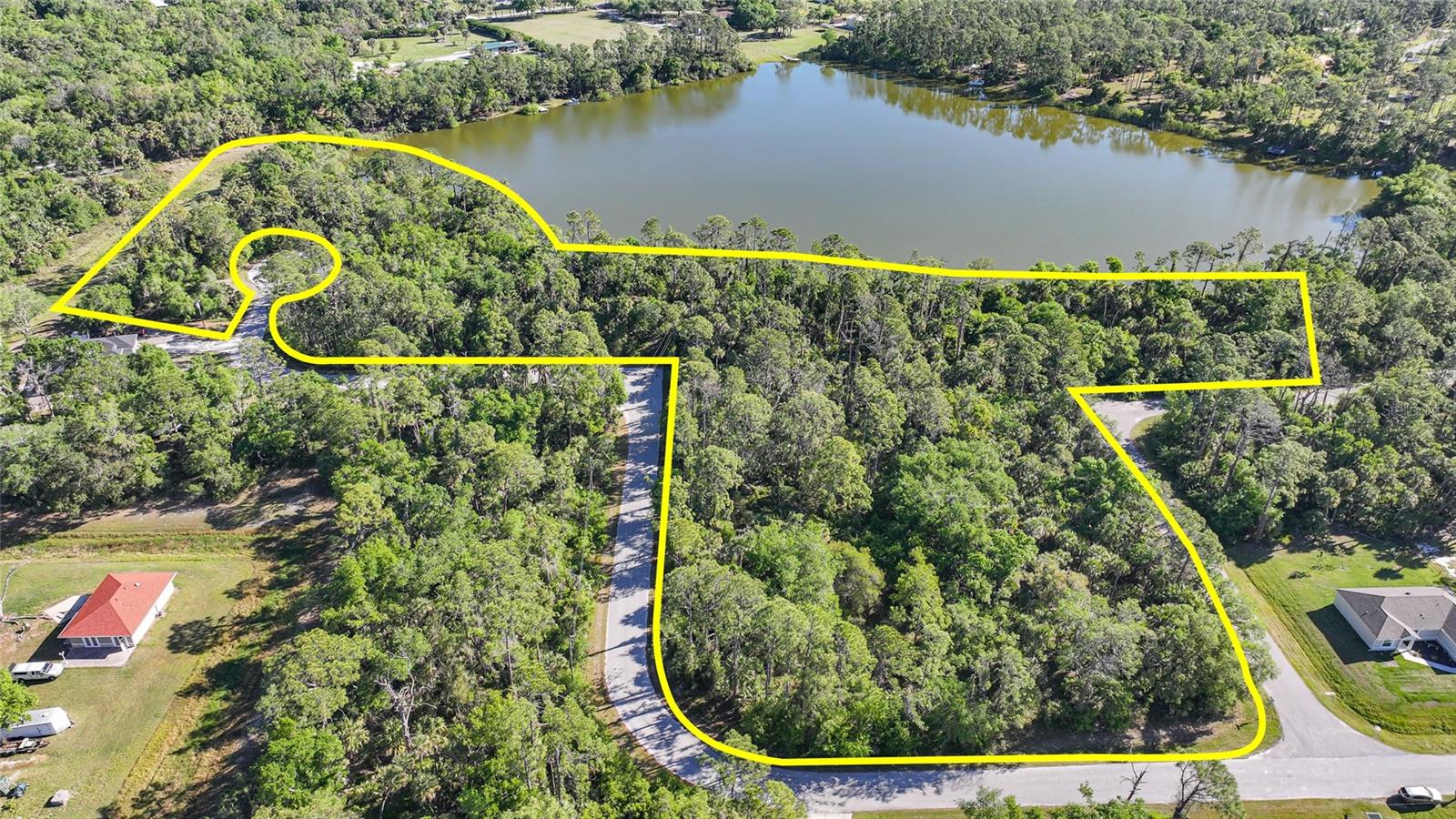 This exceptional 5+ acre lakefront lot in the prestigious North Port Estates offers both privacy and convenience. Located just minutes from I-75, the beautiful beaches of Southwest Florida, world-class fishing, boating, dining, shopping, and more, this property provides the perfect setting for your custom dream home. With agricultural zoning and no deed restrictions, the possibilities are limitless—ideal for those looking to build a barn and stables for horses or an oversized garage for all your toys. Enjoy peaceful, lakefront living on over 5 acres, all while being just a short drive from the best of Southwest Florida. Start living the Florida lifestyle today.