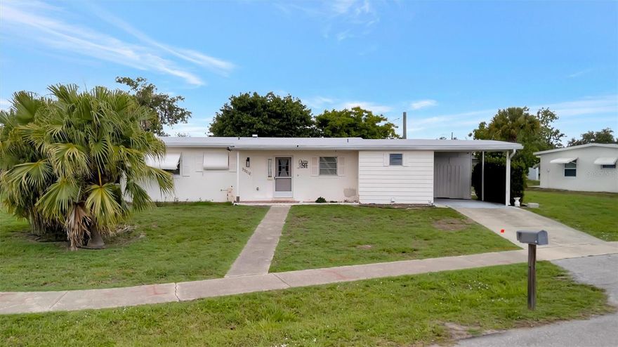Charming Port Charlotte home packed with potential with remodeled kitchen, new plumbing and electric throughout and so much more! This 2-bedroom, 1-bath home offers nearly 1,000 square feet of living space and sits on an oversized corner lot in a convenient central location. Inside you'll find a bright living area, dedicated dining space, functional kitchen, interior laundry, and a screened lanai perfect for enjoying Florida?s sunshine year-round. The attached carport includes additional storage, while the spacious yard offers plenty of room for gardening, entertaining, or future enhancements. Solid block construction and classic Florida character make this an excellent opportunity for first-time buyers, seasonal residents, or investors. Conveniently located near shopping, dining, parks, medical facilities, and just a short drive to Charlotte Harbor waterfront access, boating, and Gulf beaches. A great value with room to make it your own!