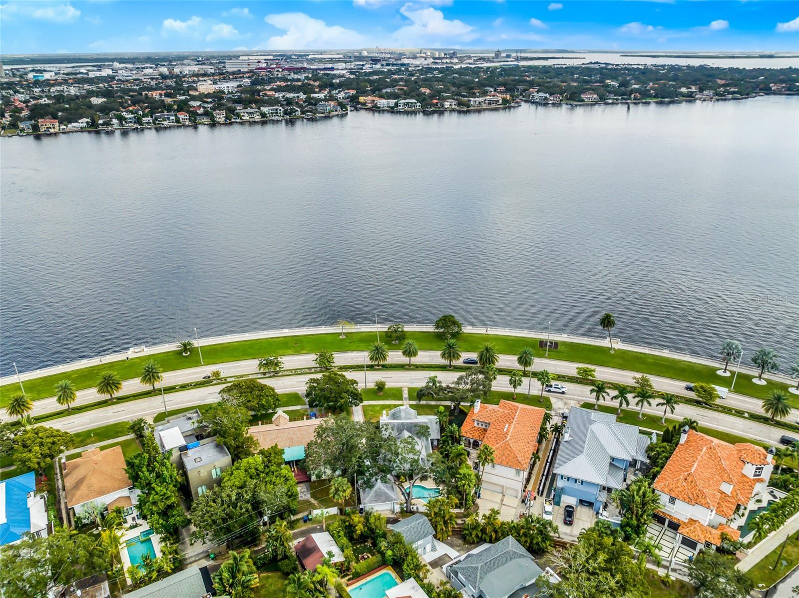 PICS ARE PRE-HURRICANE DAMAGE. HOUSE HAS NOT BEEN RESTORED. Step into this timeless Bayshore Charmer, perfectly nestled in the historic district of Hyde Park along iconic Bayshore Boulevard. One of the original properties in the area, this classic two-story home offers breathtaking waterfront views from its expansive front porch. Thoughtful modern updates blend seamlessly with the home's rich history, preserving its original charm and character throughout. Step inside and be greeted by stunning architecture and sun-drenched living spaces, framed by large windows that invite natural light to pour in. Cozy up by the wood-burning fireplace on those rare cool Florida evenings or entertain in the exquisite formal dining room, perfect for memorable gatherings. A convenient half bath and laundry room are tucked just off the kitchen. Upstairs, you’ll find all the bedrooms and bathrooms. The spacious primary suite boasts sweeping bay views, an ensuite bath with a walk-in shower, and plenty of storage. A second bedroom also features a private ensuite bath, while the third bedroom offers a perfect space for a home office or playroom. The fourth bedroom is bright and welcoming, bathed in natural light. A guest bathroom is ideally located down the hall. Step outside to your private backyard complete with a heated pool, gazebo lounge area, and lush, mature landscaping that creates a serene retreat. Enjoy biking, running, paddle boarding, or boating right outside your doorstep along Bayshore Boulevard. This property offers an opportunity to create the home of your dreams while allowing you to select all of your own finishes, fixtures and appliances to build a space that reflects your vision. Don’t miss your chance to own a piece of Hyde Park history!