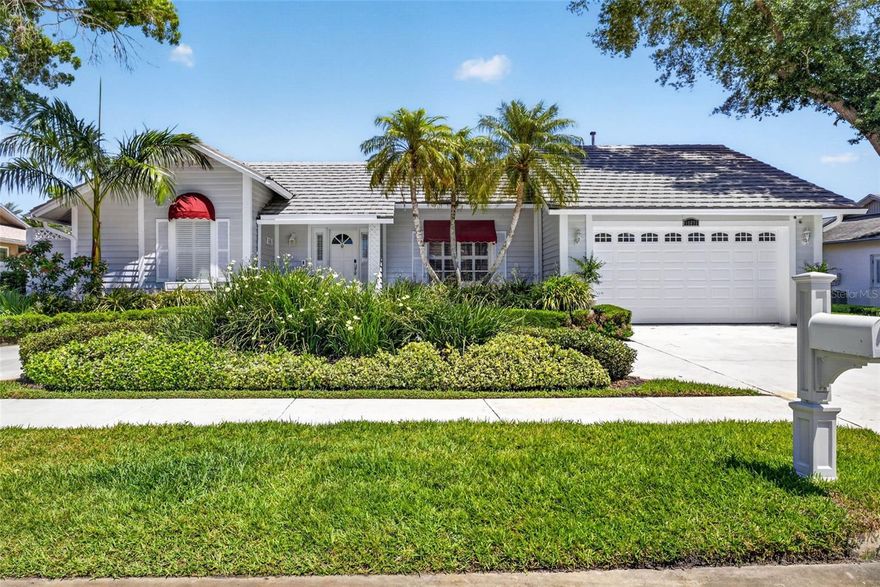 Adorable house in nice neighborhood. Close to beaches and shopping in Pinellas County.  3 full bedrooms w/ new carpet & paint! Best of all is the huge lanai that overlooks pool with spa!  AND you have a pavered walkway that goes out to a dock that sits on the pond.  This house has been well maintained and loved and is looking for its new family! Kitchen opens to family room w/dinette & coffee bar & extra cabinets.  Family room looks out over pool and has a wood burning fireplace(never used, AS IS).  Owner suite has large walk in closet and doors that open to lanai.  Owner suite bathroom has separate shower, double vanities and storage on both sides plus small enclosed area off the side to let in natural light!  Tile roof was just pressure washed and looks brand new! Exterior repainted 2026 and landscaping revamped. Garage has workbench plus extra cabinets for storage! Large circular driveway to have guests over and not have to park on street.  Don't miss this house as it will go fast!!