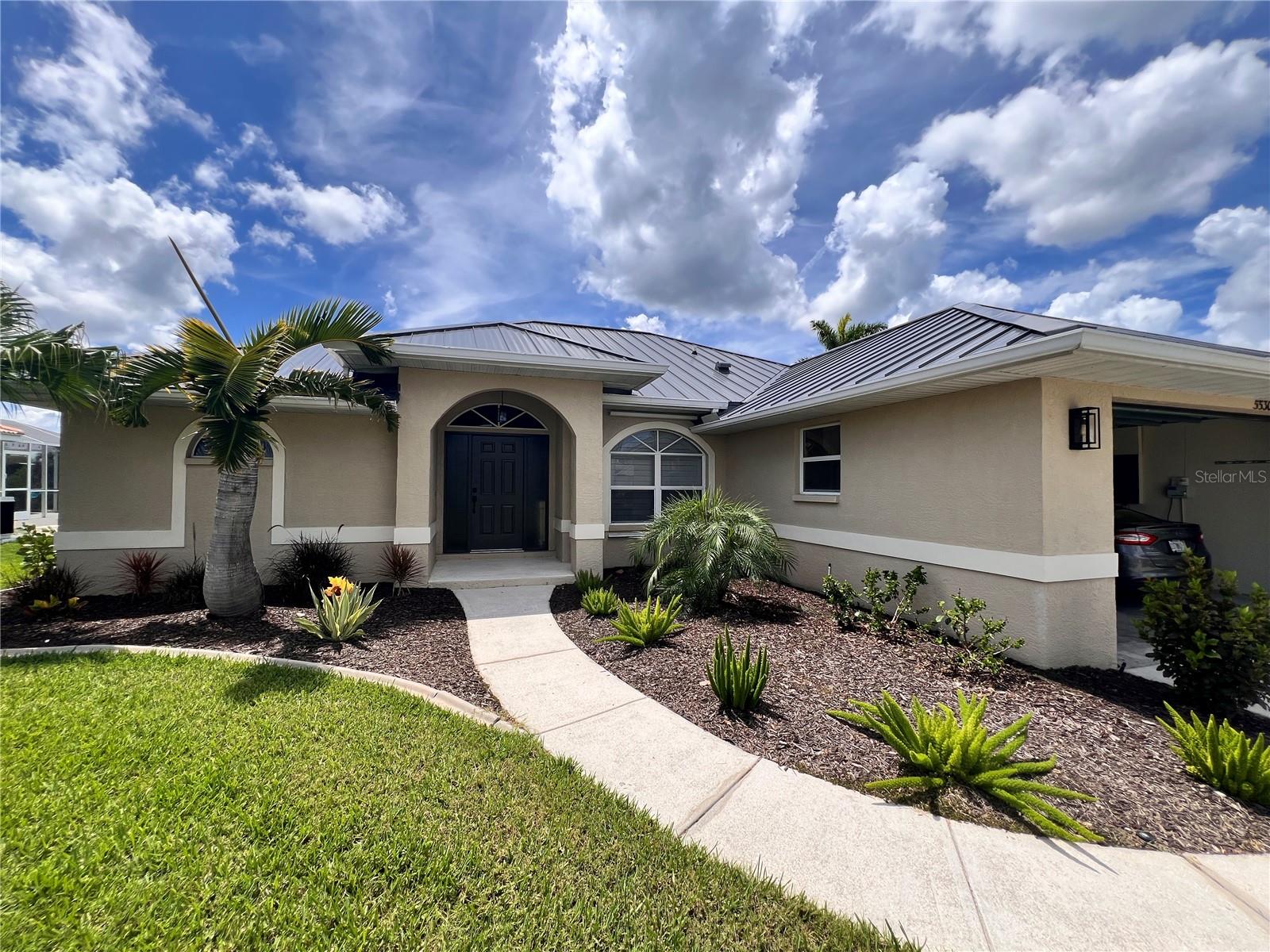 Seasonal or Annual Rental in Punta Gorda Isles – Sailboat Access Waterfront Pool Home! This beautifully updated 3-bedroom, 2-bathroom home offers direct sailboat access to Charlotte Harbor and the Gulf of Mexico via Buckley’s Pass in under five minutes—no bridges required! A boater’s paradise, the property includes a 37-foot dock with a 10,000 lb boat lift. Inside, the open-concept kitchen is both functional and stylish, featuring wood cabinetry with crown molding, under-cabinet lighting, custom storage solutions including a spice rack, soft-close drawers, and sleek new appliances. Porcelain wood-look tile flows throughout the main living areas, complemented by plantation shutters, upgraded baseboards, and modern ceiling fans for a polished finish. Both bathrooms have been fully remodeled with elegant, high-end finishes. Outdoor living is just as impressive, with nearly 1,000 square feet of expanded living space. Enjoy the sparkling built-in pool and spacious screened lanai, perfect for relaxing or entertaining against the backdrop of scenic waterfront views. Live the ultimate Florida lifestyle in this luxurious and move-in-ready waterfront retreat. Schedule your private tour today!