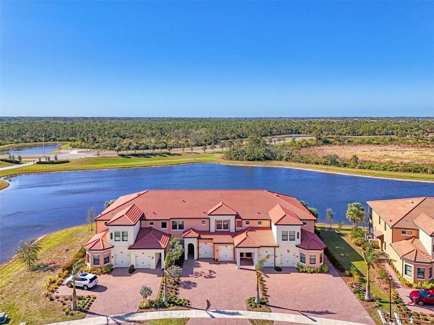 One or more photo(s) has been virtually staged. Incredible Waterfront and Tropical Views from almost every room in the Gated-Resort Community of Sarasota National Golf and Country Club. Sarasota National is an Audubon International Certified Signature Sanctuary surrounded by lakes and wetlands with beautiful wildlife. The Staggerbush Peninsula is known for hosting weekly social activities to meet your neighbors!
This maintenance free home has an extraordinary great room with high ceilings and triple sliders leading to the screened lanai with tranquil views where you can enjoy watching gorgeous sunsets. 
Chefs’ kitchen with 42-inch wood cabinets, quartz counters, Large Breakfast Island, GE stainless steel appliances, subway tile backsplash, large pantry, Spacious dining room with peaceful views of the lake. 
The king-sized primary suite boasts a large walk-in closet, a beautiful glass walk-in shower, dual sink vanity with quartz counters and private water closet. Separate guest area accommodates 2 bedrooms and a bath that allows privacy. 
 The home has high Wind Impact windows and doors, freshly painted with neutral colors, window treatments, large tile on the diagonal throughout with new carpet in the bedrooms, inside laundry has ample storage, 1 car garage with sealed brick paver driveway for additional parking. Fantastic open floor plan, perfect for entertaining! 
Amazing Amenity Campus has state-of-the-art clubhouse, 2 full-service restaurants, coffee lounge with TV’s-internet-library and pool side “Tiki Bar” to watch your favorite sports. “Dragonflies” on site Spa for facials and massage, 
well-appointed fitness center, 2 separate rooms for instructed classes, Resort style swimming pool, lap pool, water aerobics, tennis, pickle ball, bocce ball, playground, 2 dog parks and managed events for entertainment!  
Sarasota National is located close to the Atlanta Braves Spring training facility, Wellen Park for shopping and restaurants, historical downtown Venice and beautiful beaches. Call today for your private appointment to view this exceptional home!