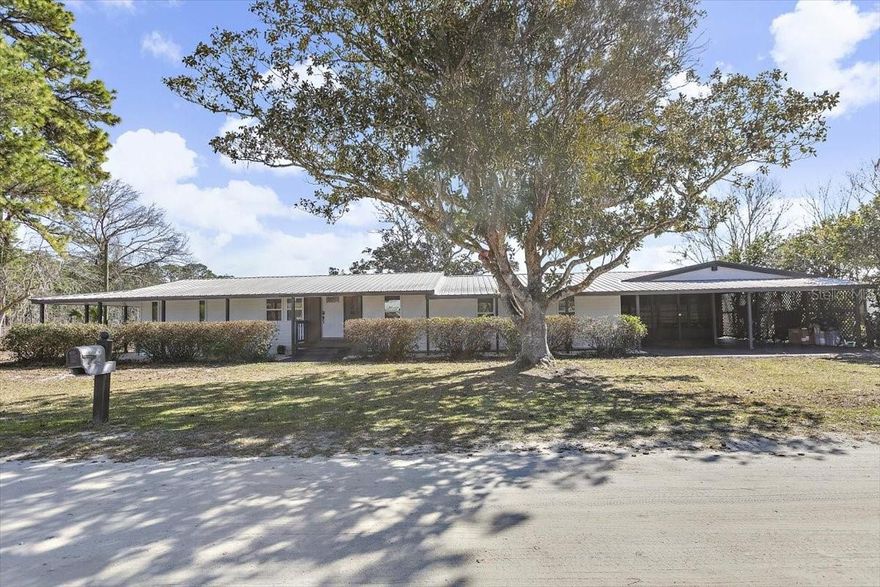 Beautifully remodeled lakefront 3-bedroom 2 bathroom home with attached in-law suite, offering an additional 1 bedroom and full bath—ideal for guests, multigenerational living, or rental potential. This home has been completely renovated, with everything new inside and out! The lakefront setting features a private dock, perfect for fishing and enjoying breathtaking sunrises. Outdoor living shines with a screened-in porch and wrap-around deck with a fish cleaning station, creating multiple spaces to relax and take in the water views. Located just minutes from the St. Johns River and deeded access to the boat ramp. Its close to Renegades, offering boat rentals, cabin rentals, restaurant, and bar—making it easy to enjoy waterfront dining and recreation. Move-in ready, beautifully updated, and perfectly positioned for laidback Florida waterfront living.