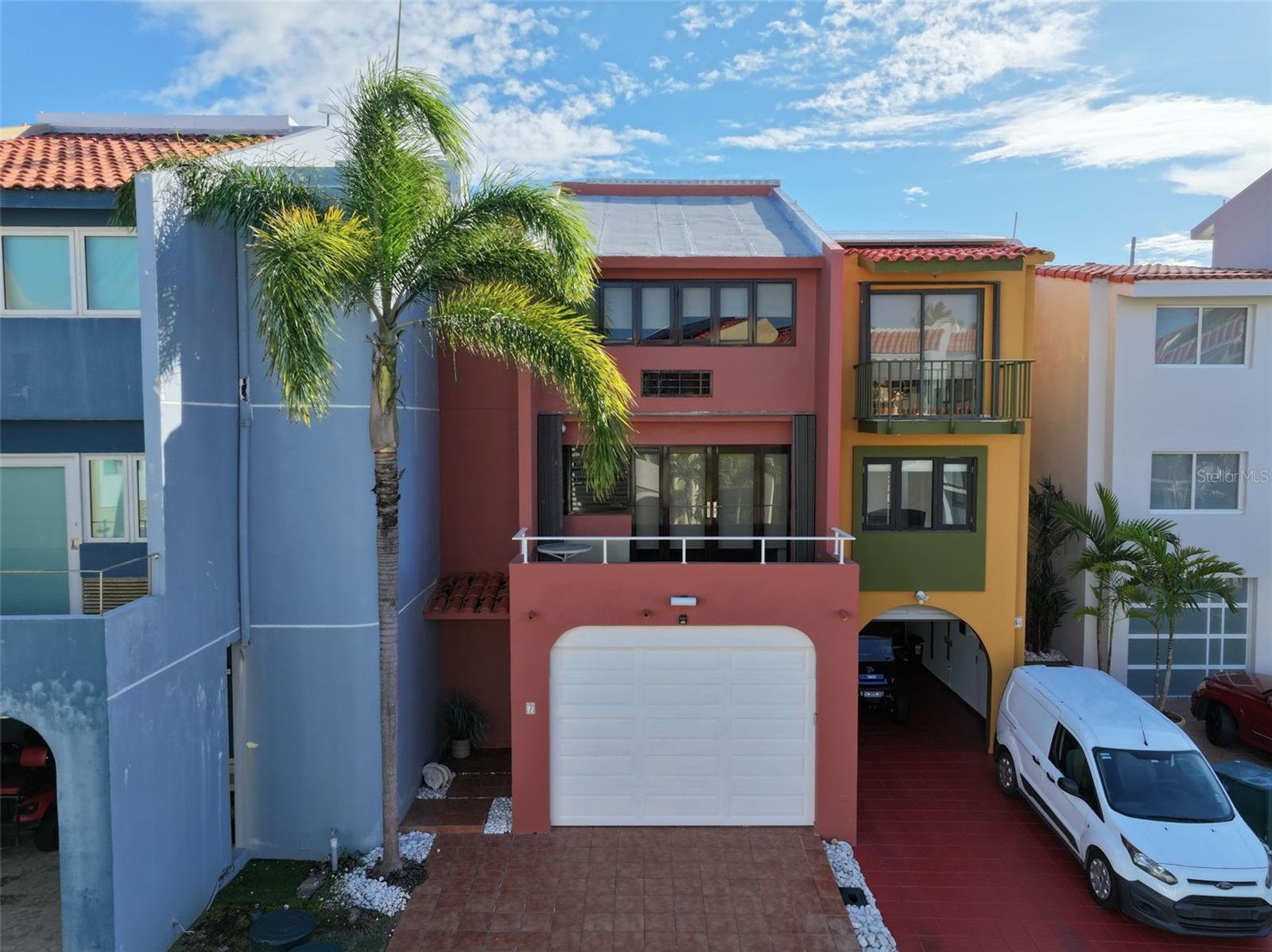 Isla San Marcos #7 is a luxurious three-story waterfront townhome located in the exclusive gated community of Isla San Marcos within Palmas del Mar, Humacao, Puerto Rico. This fully furnished residence offers 2,080 square feet of elegant living space, featuring 3 bedrooms and 3 bathrooms. It boasts a remodeled kitchen, a spacious terrace ideal for entertaining, and a manually operated generator for peace of mind. A standout feature is the 50-foot private boat slip located directly behind the home, providing instant marina access—perfect for boating enthusiasts. Residents enjoy 24/7 security, a community pool, and a quiet, close-knit neighborhood atmosphere that emphasizes long-term living. Whether as a full-time residence or a tropical getaway, Isla San Marcos #7 delivers a seamless blend of luxury, comfort, and coastal lifestyle. For more details or to schedule a private showing, contact Palmas Luxury Living Realty Group