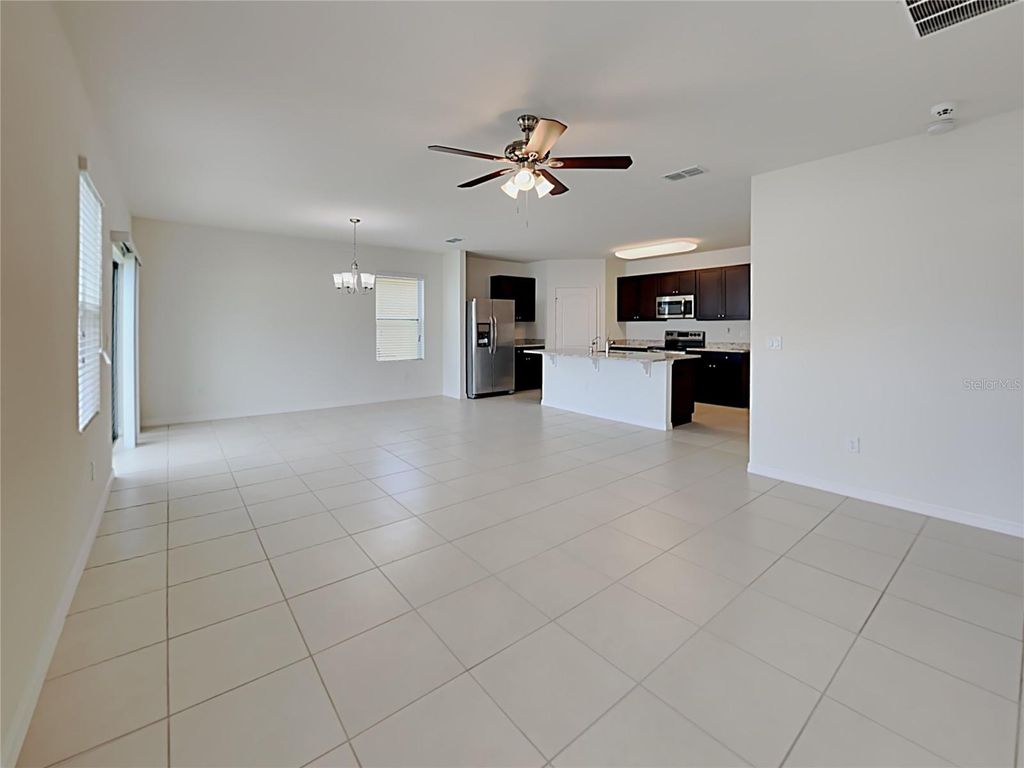 Photo of 389 Briar Patch Loop, Davenport, FL 33896 (MLS # O6357157)