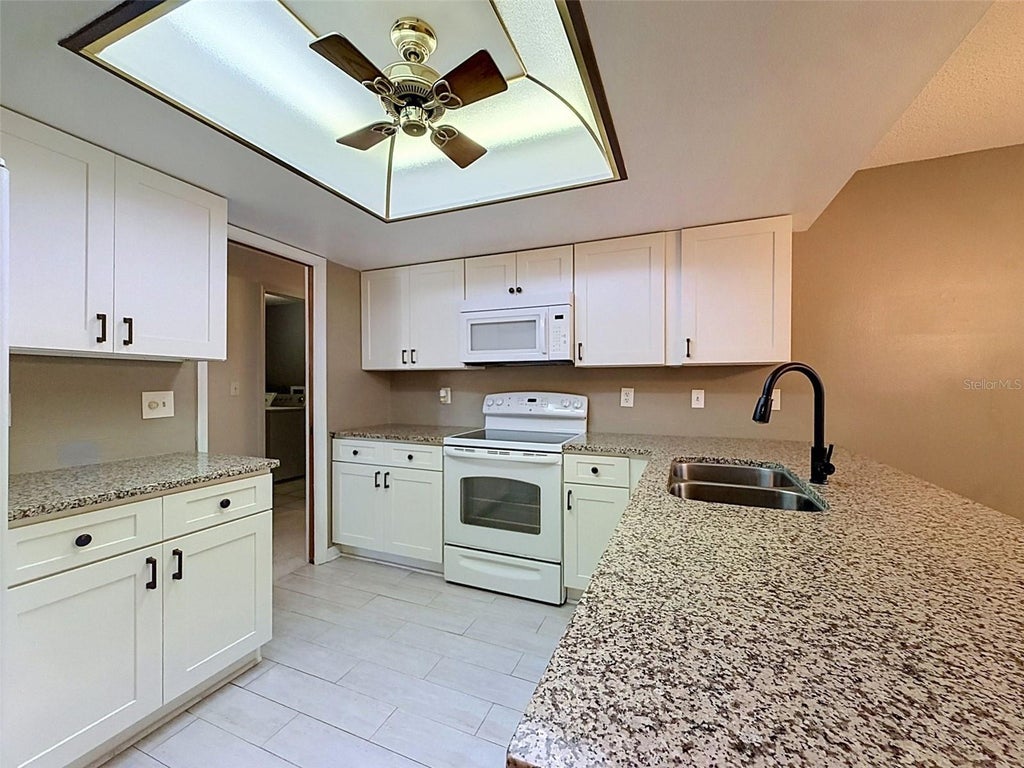 Photo of 7308 Baltusrol Drive, New Port Richey, FL 34654 (MLS # W7888585)