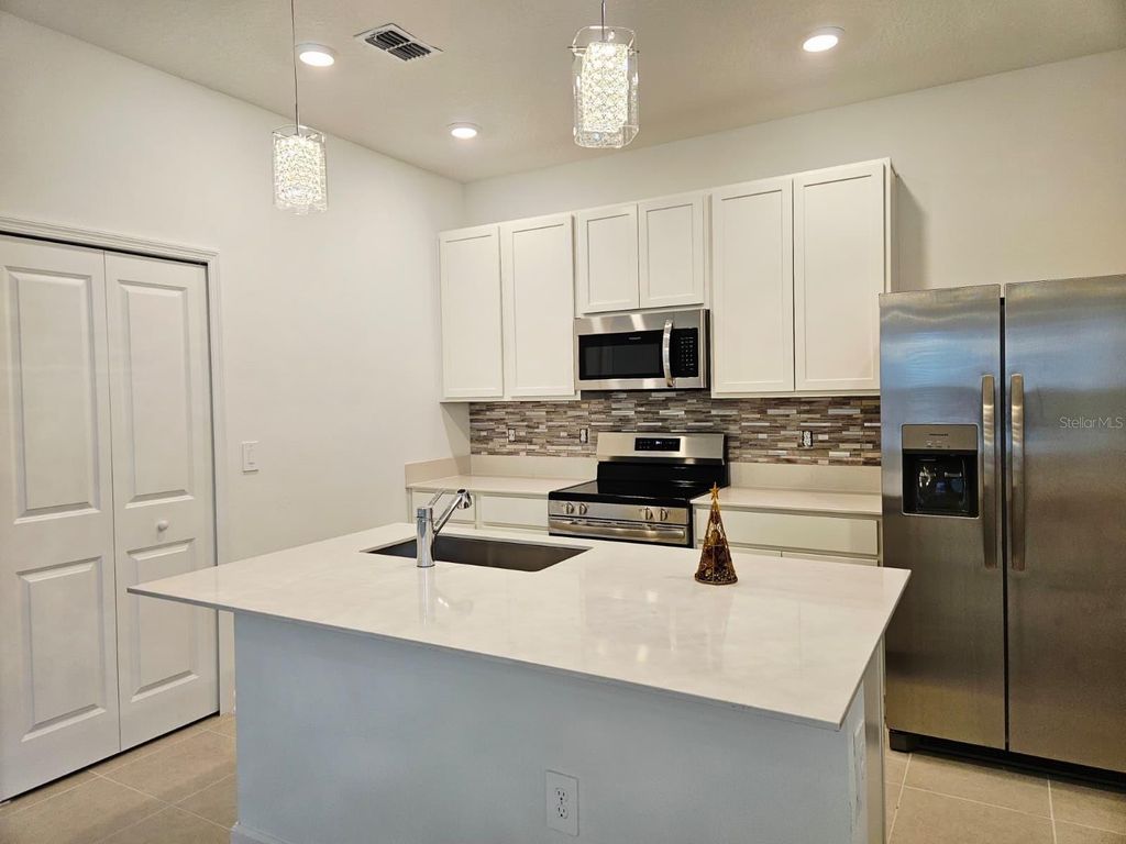 Photo of 5828 Meditation Dr, Clermont, FL 34714 (MLS # S5139084)