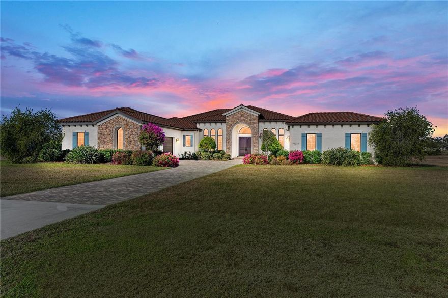 Welcome to your dream home in prestigious Sarasota Ranch Club, where luxury meets tranquility. Nestled on over 10 acres, this stunning John Cannon custom-built residence offers unparalleled privacy. Surrounded by Florida's native trees and natural foliage, making it an ideal setting for equestrian enthusiasts and nature lovers. Imagine waking up to the sight of deer grazing in your backyard and enjoying visits from wild turkeys and sandhill cranes, all while conveniently located near essential amenities. Step inside this Mediterranean-style masterpiece, boasting 3,938 sq. ft. of thoughtfully designed living space. The functional split floor plan seamlessly connects the chef's dream kitchen to the great room and dining area, perfect for entertaining. The kitchen is a culinary haven, featuring 42” cabinetry with soft-close drawers, top-of-the-line Thermador stainless steel appliances, a custom vented hood, and a spacious island. Additional highlights include a wine bar with granite countertops and a wine/beverage cooler, ensuring you have everything you need for hosting gatherings. The home is equipped with impact windows and doors, and a whole-house generator providing peace of mind and security. Step outside to your expansive brick paver screened lanai, where outdoor living reaches new heights. This custom-built space includes an outdoor kitchen, seating and dining areas, and a cozy fire pit. Dive into the heated inground saltwater pool or unwind in the jetted spa, all while enjoying the views of your lush surroundings. The master suite features a recessed tray ceiling with dimmable lights, a ceiling fan, and dual closets. Indulge in the ultimate spa-like experience within the luxurious master bath of this exquisite home. Featuring double vanities (one with a custom 3-way lighted mirror) that provide ample space for your daily routines. The highlight is the expansive two-person tiled step-in shower, perfect for unwinding after a long day. For those who enjoy the outdoors, a private two-person outdoor shower offers a refreshing escape. This master bath is not just a functional space; it is a personal retreat that elevates your everyday living. The thoughtfully designed bonus room adds versatility to this stunning property, allowing you to create a fitness haven, craft sanctuary, or even a future fourth bedroom. Each guest bedroom features custom window treatments, along with easy access to the second and third bath will ensure that your guests feel right at home. Enhance your work-from-home experience with our dual office setup. Practicality meets elegance in the convenient mudroom, which boasts a built-in bench, shelves, and a stylish wood panel design, providing an organized entryway. The laundry room is a dream come true, featuring cabinetry, a built-in ironing board,  washer/dryer, and laundry sink for added functionality. Don't forget the 9 x 11 air-conditioned storage room. The oversized two-car garage with a side entry, 220-volt charger for electric car and pull-down stairs, complemented by a separate single-car garage, offers ample storage and parking solutions.  Nestled in a beautiful community with a reasonable HOA fee that covers gated entry, common area maintenance, and horse trail upkeep, this meticulously maintained home is a must-see for those seeking luxury and comfort in their next residence while remaining close enough to the premier amenities of Lakewood Ranch and Sarasota. Call today to schedule your private showing.