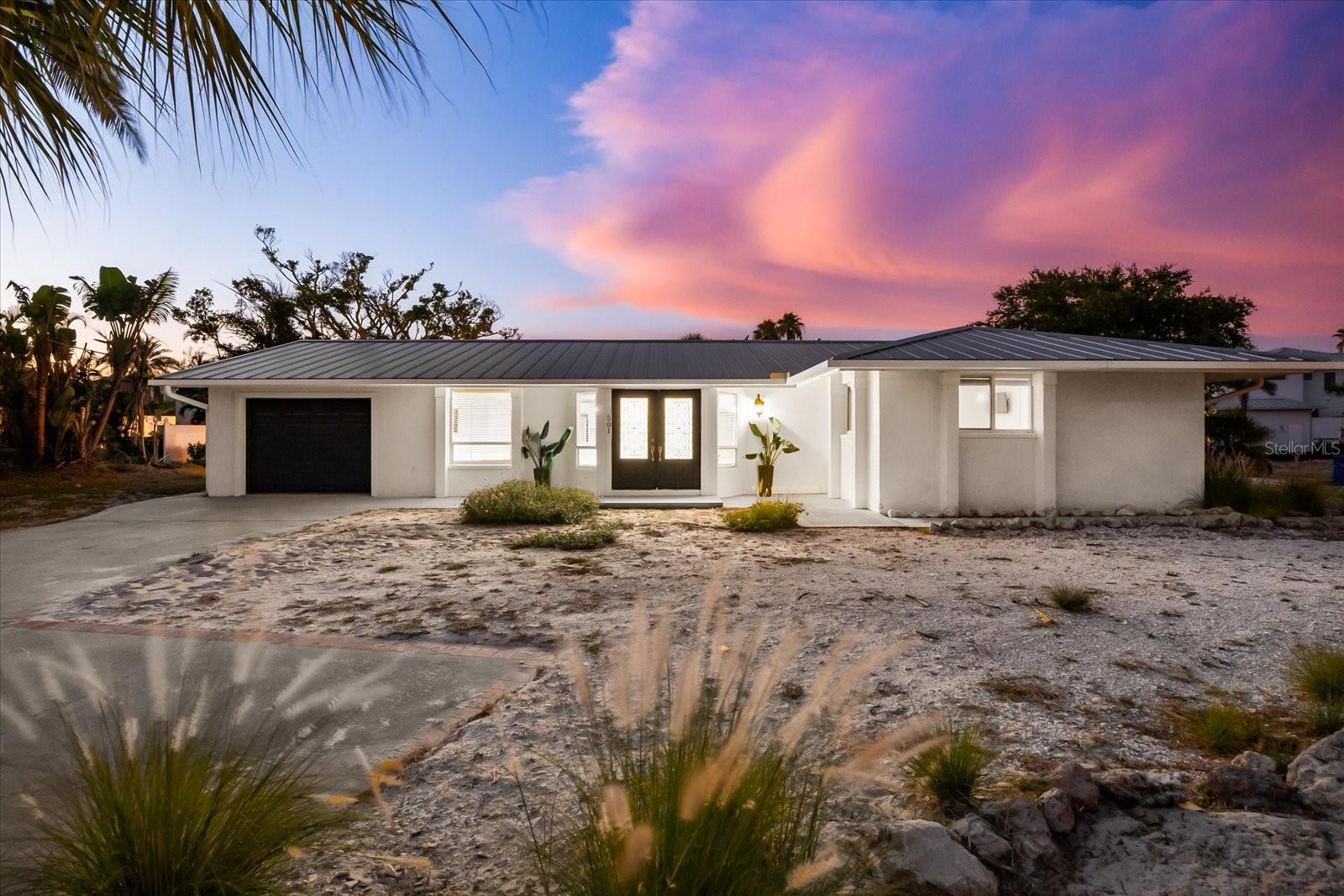 Some homes whisper. Others make a statement. 501 De Narvaez Drive commands attention—with bold architecture, elegant updates, and a prime waterfront location that elevates the Florida lifestyle into something exceptional. Nestled on a quiet corner lot in the coveted Sleepy Lagoon Park neighborhood, this home is your gateway to prestige, privacy, and the purest form of coastal living.
Spanning 1,708 square feet of refined single-story living, this 3-bedroom, 2.5-bath residence is a masterclass in modern comfort and timeless materials. Designed with block construction and finished in stucco with a durable metal roof, the home is as solid as it is stylish. Inside, terrazzo flooring sweeps across the entire home, providing a sleek and enduring foundation underfoot.
Enter into a light-drenched open floor plan, where the layout has been carefully crafted for entertaining, lounging, and effortless day-to-day living. The living room flows into a dining space and gourmet kitchen—outfitted with stone counters, solid surface tops, a spacious island, and stainless steel appliances including a convection oven and cooktop. Whether you’re entertaining guests or enjoying a peaceful morning coffee, every room connects you to the water and the outdoors.
The primary suite is an owner’s haven, complete with a walk-in closet and full bath featuring a tub/shower combination. Two additional bedrooms—each with walk-in closets—offer comfort, functionality, and flexibility. A second full bath, half bath, and spacious laundry area provide all the elements of ease and convenience.
But what truly defines this home is what lies beyond the doors. A private, heated pool, enclosed within a screened lanai, becomes your year-round sanctuary. The oversized covered deck is perfect for afternoon shade or sunset cocktails. And then there’s the water: with direct canal access to the Intracoastal Waterway, this home is a dream for boaters. The 2022 composite dock and concrete seawall are in pristine condition and ready for your vessel.
No HOA means you can live your way, and with 1-month minimum leases allowed (rental license required), this property also offers incredible short- or long-term rental potential. Add in a two-car garage, central air, electric heat, public water/sewer, and fiber optic internet, and you have every modern amenity at your fingertips.
This is more than just a home—it’s a statement of lifestyle. A bold, beautiful, and rare opportunity to own in one of Longboat Key’s most established and beloved communities, just moments from world-class beaches, golf, fine dining, and everything the Sarasota area has to offer.
For the visionary buyer who seeks distinction, privacy, and water access—501 De Narvaez is where your story begins.