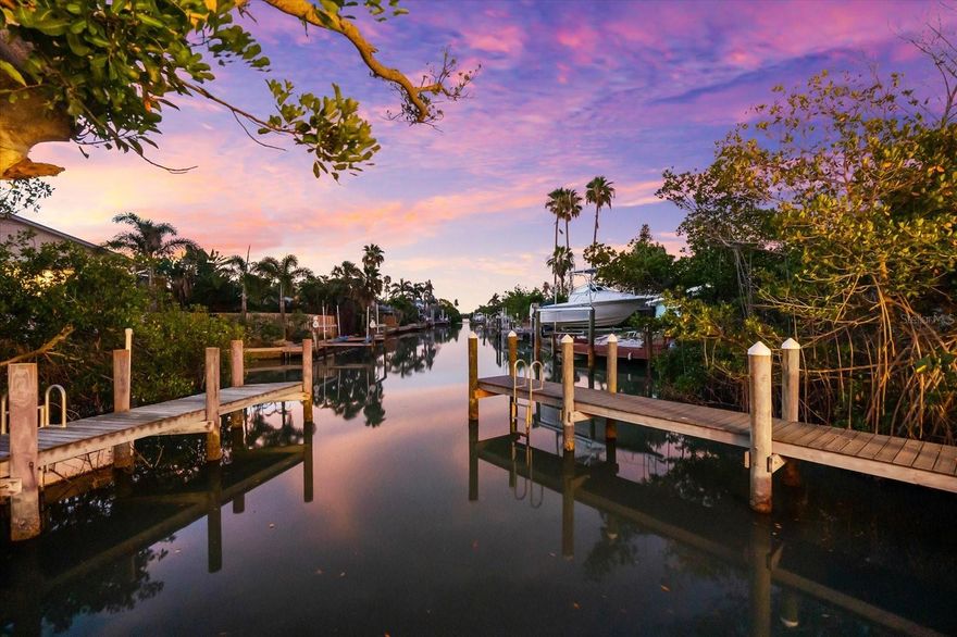 Some homes whisper. Others make a statement. 501 De Narvaez Drive commands attention—with bold architecture, elegant updates, and a prime waterfront location that elevates the Florida lifestyle into something exceptional. Nestled on a quiet corner lot in the coveted Sleepy Lagoon Park neighborhood, this home is your gateway to prestige, privacy, and the purest form of coastal living.

Spanning 1,708 square feet of refined single-story living, this 3-bedroom, 2.5-bath residence is a masterclass in modern comfort and timeless materials. Designed with block construction and finished in stucco with a durable metal roof, the home is as solid as it is stylish. Inside, terrazzo flooring sweeps across the entire home, providing a sleek and enduring foundation underfoot.

Enter into a light-drenched open floor plan, where the layout has been carefully crafted for entertaining, lounging, and effortless day-to-day living. The living room flows into a dining space and gourmet kitchen—outfitted with stone counters, solid surface tops, a spacious island, and stainless steel appliances including a convection oven and cooktop. Whether you’re entertaining guests or enjoying a peaceful morning coffee, every room connects you to the water and the outdoors.

The primary suite is an owner’s haven, complete with a walk-in closet and full bath featuring a tub/shower combination. Two additional bedrooms—each with walk-in closets—offer comfort, functionality, and flexibility. A second full bath, half bath, and spacious laundry area provide all the elements of ease and convenience.

But what truly defines this home is what lies beyond the doors. A private, heated pool, enclosed within a screened lanai, becomes your year-round sanctuary. The oversized covered deck is perfect for afternoon shade or sunset cocktails. And then there’s the water: with direct canal access to the Intracoastal Waterway, this home is a dream for boaters. The 2022 composite dock and concrete seawall are in pristine condition and ready for your vessel.

No HOA means you can live your way, and with 1-month minimum leases allowed (rental license required), this property also offers incredible short- or long-term rental potential. Add in a two-car garage, central air, electric heat, public water/sewer, and fiber optic internet, and you have every modern amenity at your fingertips.

This is more than just a home—it’s a statement of lifestyle. A bold, beautiful, and rare opportunity to own in one of Longboat Key’s most established and beloved communities, just moments from world-class beaches, golf, fine dining, and everything the Sarasota area has to offer.

For the visionary buyer who seeks distinction, privacy, and water access—501 De Narvaez is where your story begins.