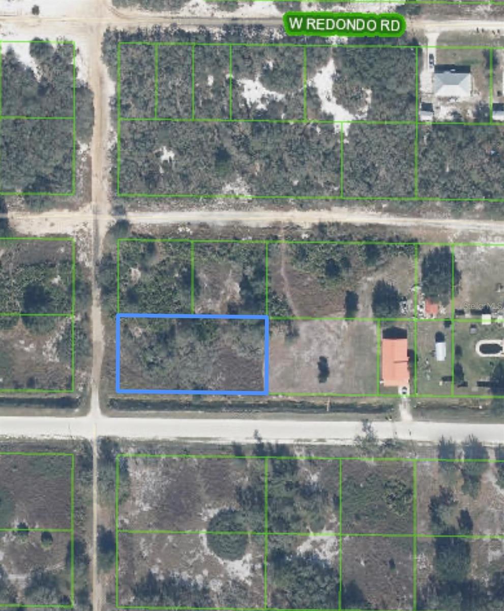 Whether you’re planning to build now or invest for the future, this spacious, nearly 1/2-acre corner lot offers endless potential! This property is adorned with lots of natural beauty and has plenty of open space to suit your needs. Encompassing lots 13, 14, 15 and 16 with electricity running on the road.