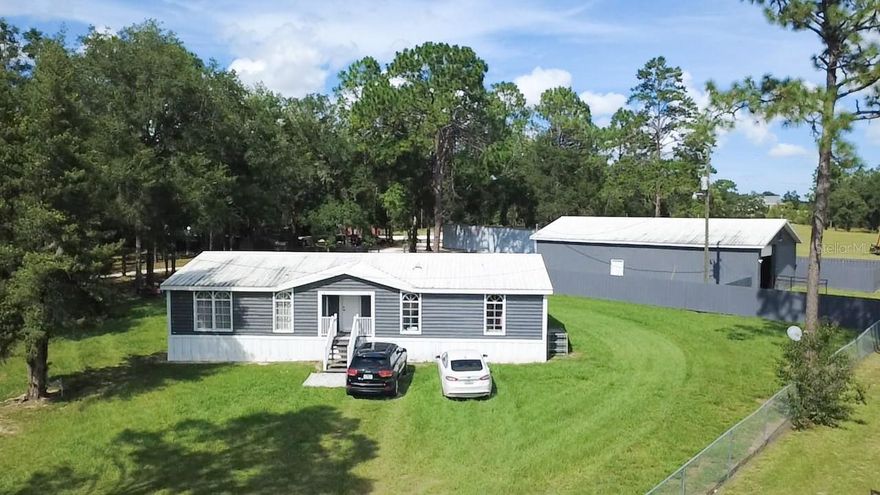 OVER 25 ACRES IN AN EXCELLENT LOCATION IN DUNNELLON BETWEEN CR 328 & HWY 41. Discover the vast possibilities of this extensive 25.34-acre farm property, fully fenced and clean, with an electric gate for easy entry and exit; It has two access entrances, one leading to CR 328 and the other via HWY 41. It's a hidden gem with unlimited potential, as it can be subdivided into two large plots for up to four homes, you can also create your own agricultural business or equestrian property. Nestled on the land is a 1,760 sq ft, 3-bedroom, 2-bathroom mobile home with a large front and back porch that leads into a fully renovated home featuring a spacious living room and kitchen with wood cabinetry and waterproof laminate flooring throughout; the 3 spacious bedrooms each have walk-in closets. Additionally, this wonderful residence features a tall garage that can accommodate heavy equipment and park up to 4 vehicles. Attached to the garage is a one-bedroom, one-bathroom apartment. It also features a large metal barn with an indoor storage room. The property is ideal for horse lovers and those aspiring to raise livestock, offering ample space and the freedom to design their ideal country lifestyle. This is an exceptional opportunity to own a sizable piece of land in a prime location, offering both the peace of the countryside and the convenience of proximity to city services. Located just minutes from the Ocala Breeders' Sales Co. (OBS) Ocala Equestrian Center, the Rainbow River, Sisters Spring in Crystal River where you can watch manatees, and the City of Dunnellon, this home is ideal for both horse enthusiasts and agricultural business investors. Don't miss this incredible opportunity to own a versatile property: make it your primary residence, vacation retreat, or investment gem. Schedule your showing today!