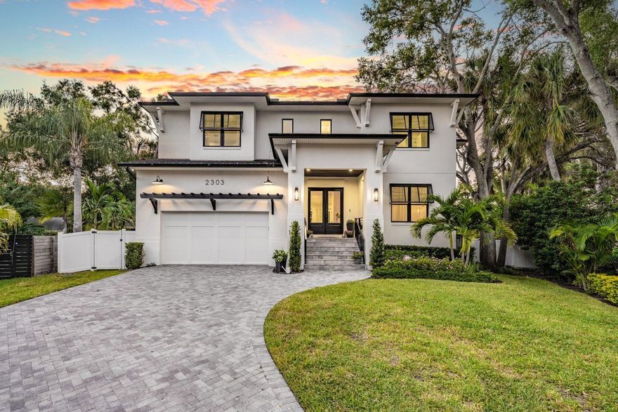 Welcome to 2303 S San Jose Circle, where Style and Sophistication meet to create an Exquisite Living Experience. Introducing a Truly Breathtaking home in the heart of South Tampa’s Sunset Park. This LIKE NEW residence (Built in 2022) is situated on a premium extended cul-de-sac lot with an Amazing Pool Area and Dream Backyard! Brick Pavered Driveway leads to this warm and inviting 4,622 Sqft Home showcasing 5 Bedrooms, 4.5 Baths, 2 Car Garage with 1st Floor Guest Suite, Office, and Large Bonus Room/Game room with Wet Bar and Beverage Fridge. When you step inside you will fall in love with this Expansive OPEN Floor plan with high-end finishes. The Heart of the Home is the Chef's Inspired Kitchen offering Thermador Appliances, Industrial Sized Stainless Steel Hood, 48” Gas Range, Double Ovens, Double Column Refrigerator/Freezer, Double Stacked Custom Cabinets, Under Cabinet Lighting, Beautiful Quartz countertops, and a Large Walk-in Pantry. The huge Island opening to the Dining area & Great Room is an Entertainer's Dream! Wide plank Luxury Engineered Hardwood Flooring throughout, Impressive Architectural Details, Beams, Crown Molding, plus a Mud Room with Built-Ins right off the Garage.  French doors lead to the amazing outdoor living space, including an Outdoor Kitchen and a covered Balcony which runs the whole length of the home, providing plenty of outdoor living space, and overlooking the pool area. The First Floor Guest Suite with Walk-in Closet & En-Suite Bath features Dual Sinks and Step-in Shower. Escape Upstairs to the private Master suite which features 2 Large Walk-in Closets with Built-In Organizers, a Spa-Like Bath featuring an Exquisite Step-in Shower, 6 Shower heads (2 Rain Shower heads), Free Standing Tub, & Dual Vanities with Quartz Countertops. Two Additional Bedrooms share a Jack n Jill Bath with Dual Sinks. 5th Bedroom with adjoining Bath with Tub/Shower. Large Bonus Room has endless possibilities, and could fit a pool table with bar area for entertainment. Experience an Amazing Outdoor Lifestyle and Enjoy a Dip in the Sparkling Pool with Spill over Spa & Fountains complete with Travertine Deck space for Lounging and an abundance of green yard space. You will LOVE the HUGE fenced-in Backyard with plenty of space for fun and utility. Finding a like new home with a large lot in Tampa is rare! The tropical landscaping and vinyl fencing provide privacy and security. This Energy efficient Home has 2 Tankless Hot Water Heaters, Tesla compatible connection in garage, and Energy efficient Low-E impact glass windows. This amazing Home will surpass your expectations of quality, styling and craftsmanship. Call to set up your private showing today.