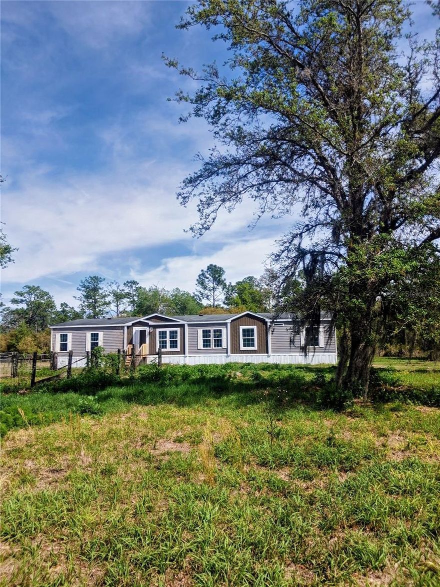 Its all PLAY!  2.5 acre corner lot on a dirt road!  Goats, Horses, Hogs, Cattle and all the like are welcome here along with crops! 4 wheel mud slinging in all its glory at the Highland mud hole nearby.  Zoned to accept a guest house on the property in addition to the main house. This very spacious and bright 4 bedroom 2 bathroom home has been renovated with new linoleum flooring, updated bathrooms and kitchen!  This is a true gem of a home filled with adventure, privacy and continuos growth. Plenty of room for a pool as well.  Be prepared to take the county dirt road to the home and come across a soft spot or 2.  Standard drive has proven to get you there as well as a truck!  Interior and Drone photos 4.10.2026.  All measures are approximate.