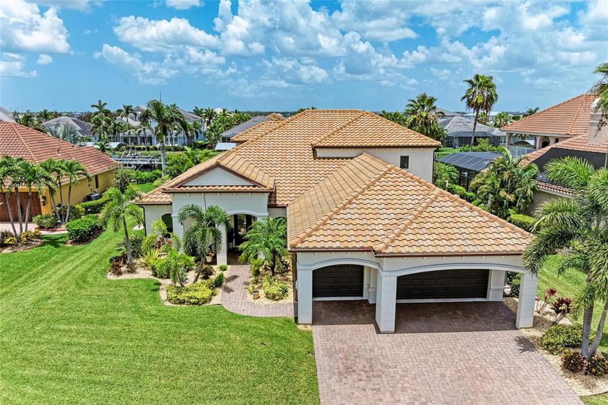 Welcome to this coastal contemporary masterpiece in the gated waterfront community of Harbour Walk at The Inlets. This meticulously maintained and extensively upgraded home offers the ultimate in Florida luxury living. The deep saltwater canal has direct (no-lock) access to the Manatee River, Tampa Bay, and the Gulf. Spanning nearly 3,900 sq ft, this custom-designed residence boasts extensive remodeling, including a stunning primary ensuite bathroom and a chef-inspired kitchen with updated appliances, built-in refrigerator, double ovens, an oversized island, and a generous walk-in pantry ideal for entertaining and everyday living. The open-concept layout features a spacious great room and dining area with breathtaking views of the water. The first floor includes the serene primary suite, a den, and a versatile bonus room, offering flexible living spaces. Upstairs, you’ll find three additional bedrooms, including one ensuite, another full bath, and a large bonus room perfect for guests, media, or recreation. Step out onto the private balcony for sweeping views of the canal and the tranquil Florida landscape. Enjoy year-round outdoor living on the expansive covered lanai, featuring a summer kitchen, an oversized heated saltwater pool with a eight-person hot tub, and a no-see-um screened enclosure. Boaters will appreciate the covered boat lift, complete with a composite dock and shore power leading to your next adventure. Watch manatees and fish right from your dock. This home offers the utmost in waterfront living. Additional upgrades and features are available on the feature sheet.