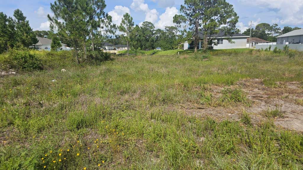 Photo of 1400 Venice Avenue N, Lehigh Acres, FL 33971 (MLS # O6421600)