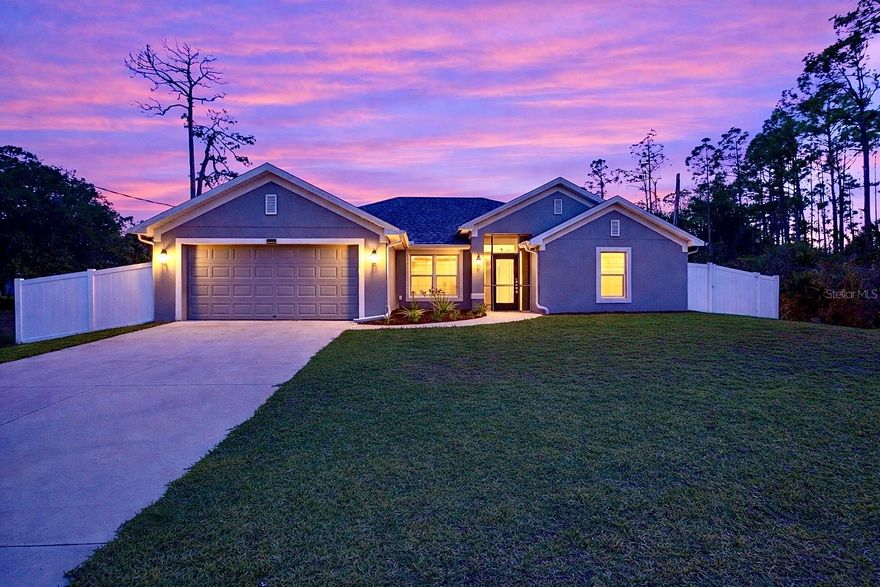 From the moment you arrive, the welcoming covered and screened front porch sets the tone for this inviting home. Step through the front door, framed by elegant sidelights and a transom window that fills the entry with natural light, and you are immediately greeted by a bright, open space that feels both comfortable and welcoming. Tall vaulted ceilings and an abundance of windows create an airy atmosphere, while beautiful luxury vinyl flooring flows throughout the main living areas, adding warmth and style.
The spacious kitchen serves as the heart of the home and the perfect gathering place for everyday living. A large center island invites friends and family to gather, while stainless steel appliances, granite countertops and a convenient closet pantry provide both style and functionality. Just off the kitchen, a sunny breakfast area offers the perfect spot to start your morning with coffee and sunshine, while the separate formal dining room creates an inviting space for holiday meals and special occasions.
The open concept layout flows into the great room, creating a comfortable space for relaxing evenings, entertaining or movie nights. The separate dining room also offers flexibility and could easily serve as a home office, playroom, workout space or additional living area depending on your needs.
Designed with privacy in mind, the split bedroom floor plan places the primary suite on its own side of the home, creating a peaceful retreat. The spacious suite features tall ceilings and plenty of room to unwind. The ensuite bathroom includes a double vanity, a walk-in shower with glass doors, a relaxing garden tub and a large walk-in closet designed to keep everything organized. A smart lock for the primary suite adds an extra layer of convenience and security.
Two additional bedrooms share a Jack and Jill bathroom, while a fourth bedroom and a third full bathroom provide comfortable space for guests, family members or a home office. A dedicated laundry room adds everyday practicality to the thoughtful layout.
Step outside to the covered and screened lanai where you can enjoy quiet mornings or relaxed evenings overlooking the backyard. A convenient doggy door from the lanai allows furry friends easy access to the fully fenced yard, making the outdoor space perfect for pets, play and outdoor gatherings. With no neighbors directly on either side and mature trees surrounding the property, the setting feels peaceful and private while still being conveniently located close to shopping, dining and everything North Port has to offer.
Built in 2019 and equipped with smart home features including an Ecobee smart thermostat system, this beautifully maintained home blends modern convenience with comfort, privacy and flexible living spaces designed for today’s lifestyle.