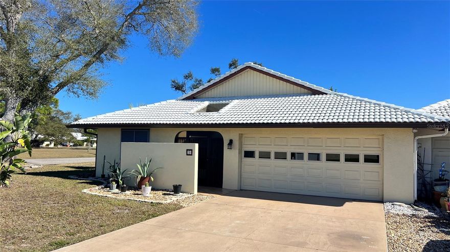 Welcome to effortless Florida living in this beautifully maintained, semi-furnished end-unit villa nestled in the sought-after, maintenance-free community of Hourglass Lakes. Featuring 2 bedrooms, 2 bathrooms, and a spacious 2-car garage, this residence offers a refined blend of comfort, privacy, and convenience.



Vaulted ceilings and impact-rated sliding glass doors flood the interior with natural light, creating a warm and inviting ambiance. The split-bedroom floor plan offers ideal separation for privacy, complemented by new vinyl plank flooring throughout the main living areas. The kitchen combines functionality and charm with Corian countertops, ample cabinetry, a new refrigerator and range, and a breakfast nook.



Designed with indoor-outdoor living in mind, the open dining and living areas flow to a covered front porch, two screened side patios with privacy walls, and a versatile enclosed back room—perfect as a home office, creative studio, or relaxation space.



The primary suite is a true retreat, featuring a walk-in closet and en-suite bath with dual vanities and a walk-in shower. With partial furnishings included, you can settle in with ease.



Enjoy the relaxed lifestyle and amenities of Hourglass Lakes, including a clubhouse with a library, full kitchen, and meeting space, a heated pool and spa, fitness center, and scenic walking trails along tranquil lakes.



Ideally situated in the heart of Venice, you’re just minutes from Manasota Key and Venice Beaches, the boutique charm of Downtown Venice Island, and the vibrant offerings of Wellen Park, including dining, shopping, community events, and the Atlanta Braves Spring Training Stadium.