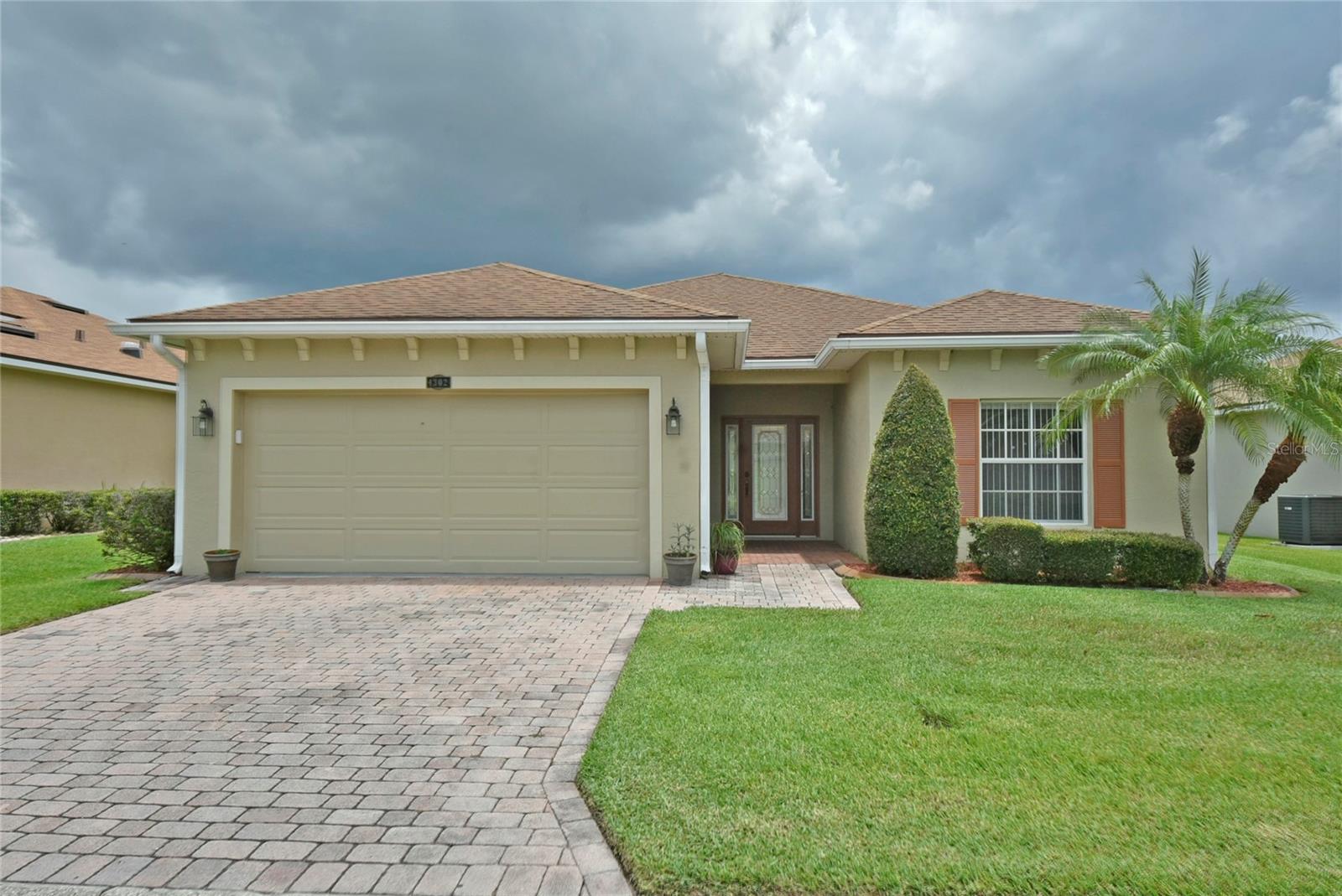 This 2-bedroom, 2-bath Caribbean-style floorplan home is situated on a premium golf course frontage lot. Numerous upgrades and refurbishments are evident in this open-concept home. The quality plantings, along with the paver drive and walkway, enhance the curb appeal. The leaded glass front door with sidelights provides excellent natural light to the welcoming foyer. The living room is located in the center of the home, with the south wing containing the bedrooms and bathrooms, and the north wing housing the dining room, kitchen, and an attached two-car garage. The bonus room is adjacent to the living room and features a triple slider that opens onto the large, birdcage-enclosed patio. The kitchen features new cabinetry, a spacious pantry closet, and a smaller closet. The attached 2-car garage has an opener, a service door, and a window. The guest suite is accessed by a pocket door in the foyer, a feature that allows for the complete privacy of the guest suite from the rest of the home. The guest bedroom is located at the front of the house and features a ceiling fan and a spacious reach-in closet. The guest bath is conveniently located adjacent to the room and features a combination tub and shower, an elongated dual-flush toilet, and a nearby linen closet. The primary suite is at the rear of the home and has a spacious bedroom with a ceiling fan. A short hallway connects the primary bedroom to the primary bathroom and houses two walk-in closets. The primary bathroom features a large stall shower with glass shower doors, a vanity with two sinks, and a window for natural light. All ceiling fans have light fixtures. Renters must comply with the HOA and CDD rules and regulations. One member of the household must be 55 years old or older, and no occupant under 40 years old is permitted to reside.
Lake Ashton is Central Florida's premier gated and guarded 55+ active adult resort-style living community. Renters have access to all of the amenities Lake Ashton residents enjoy. The main clubhouse features a full-service restaurant and bar (Charm City Grill) that also offers outdoor dining. Other amenities at the main clubhouse include a large ballroom, movie theater, poker/billiards room, craft room, media room, bowling center, table game room, fitness room, and meeting rooms. The main clubhouse grounds feature lighted tennis and shuffleboard courts, a basketball court, horseshoe pits, a community gazebo, a veterans' memorial, English gardens, a heated pool and spa, and lawn bowling and bocce courts. The Health and Fitness Center is a 30,000-square-foot facility featuring an indoor pool, ballroom, computer/media room, card rooms, billiards room, craft room, fitness room, saunas, multi-purpose room, racquetball court, rose garden, and spa patio. Lighted pickleball and tennis courts are located adjacent to each other. The golf pro shop building also has a full-service bar that serves great comfort food. Lake Ashton also features two private par-70 golf courses that renters can join. Membership options are available. An onsite storage facility is also available for residents to rent open, covered, enclosed, and climate-controlled units.