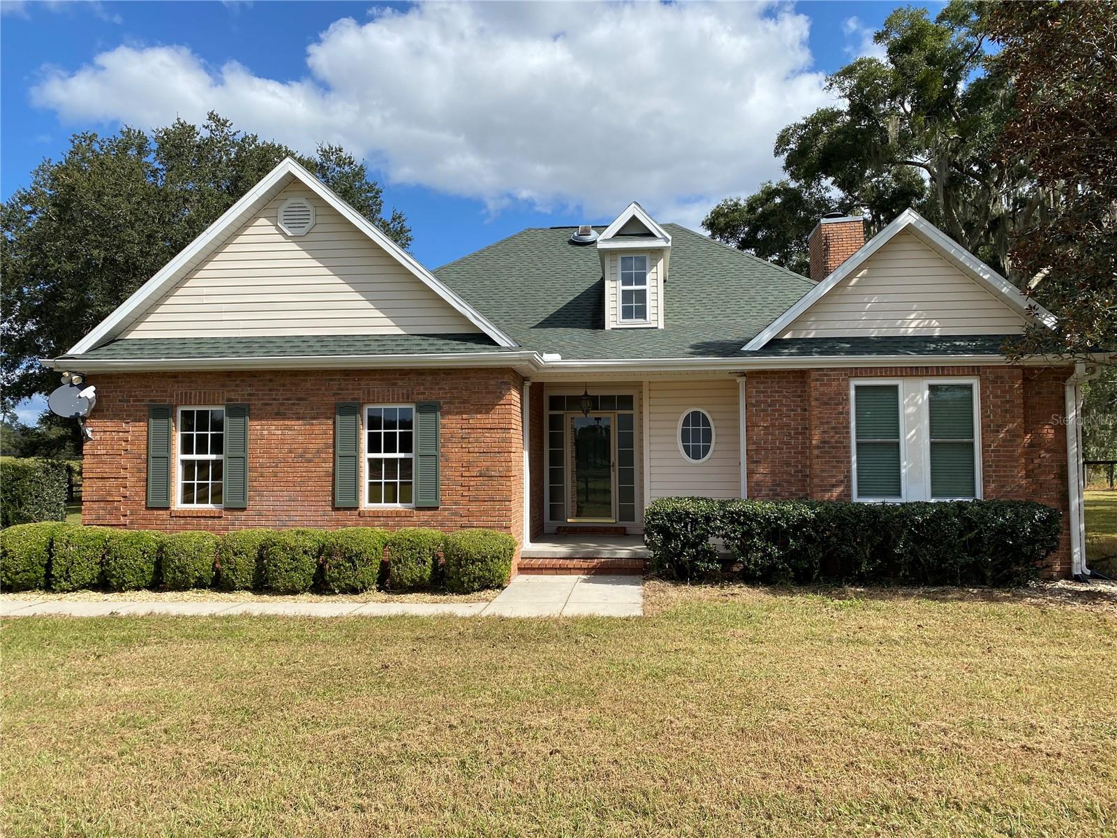 This beautiful, fully fenced 10 acre farm has 6 paddocks and boasts two concrete block center aisle barns with an abundance of natural light and air flow. The smaller barn has four, 12x12 matted stalls, a full bathroom, 2 air conditioned storage rooms, hot water and a washer dryer hook up. The main barn has 6 12x12 matted stalls with a large tack room and separate feed room. A back overhang allows plenty of room for storage. The 3 bedroom, 2 bathroom home is decked with high end finishes including, wood floors through out, upgraded appliances, stone countertops, a spa like en suite in the primary bathroom, and features high ceilings that make the home feel open and bright. The beauty of the house and the functionality of the barn pair perfectly together to create a well rounded farm.