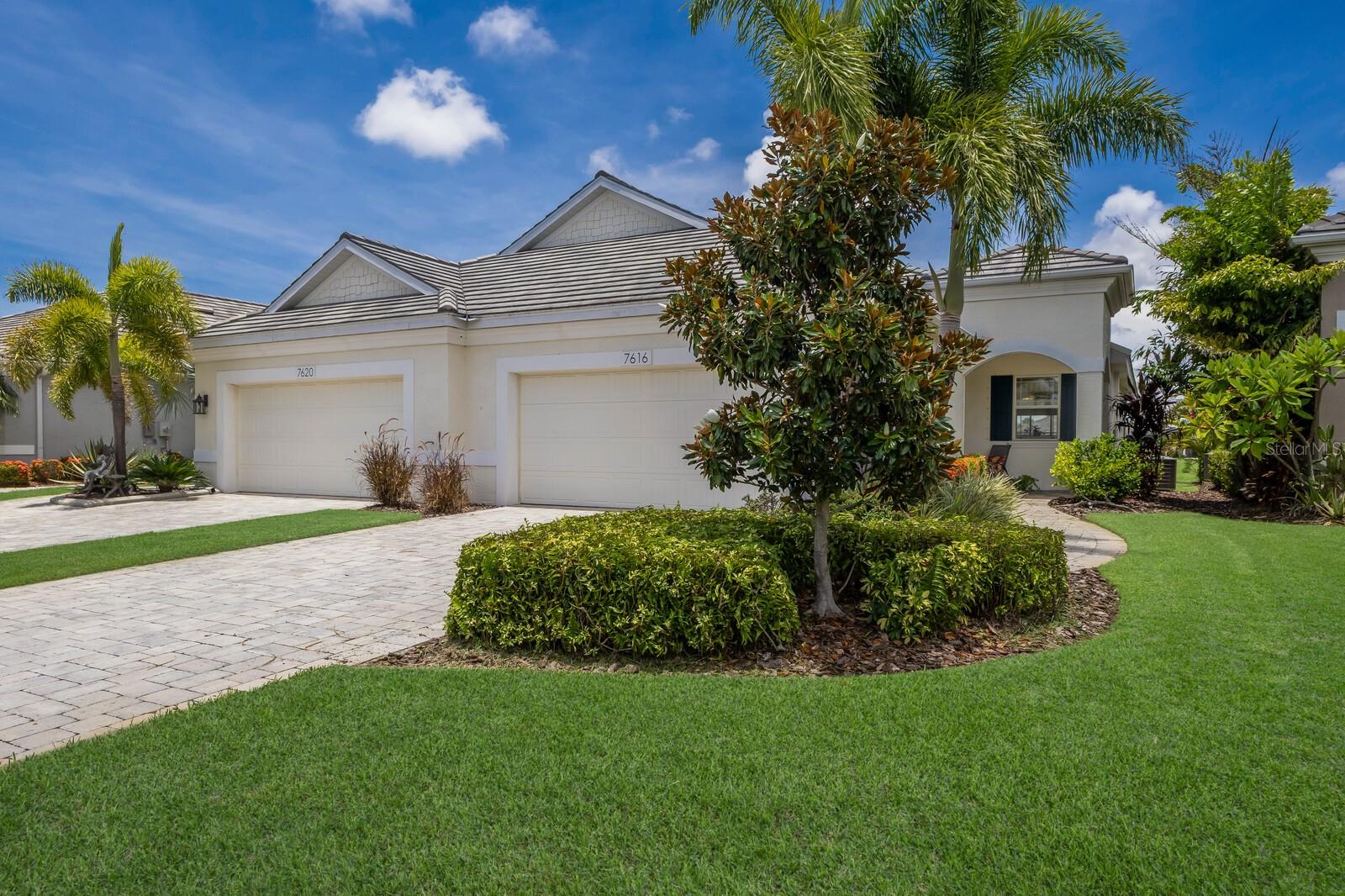 Welcome to University Village, a gated and maintenance-free community conveniently located near the top attractions in Sarasota and Bradenton. Don’t miss the opportunity to own this immaculately maintained villa with a stunning lake view. This villa features an open floor plan that is ideal for entertaining guests. The kitchen is equipped with wooden cabinets, granite countertops, and a spacious island, perfect for food preparation and additional seating. The split-bedroom layout ensures privacy for everyone, while the owner's retreat includes a large picture window, a walk-in closet, and a private bathroom with dual vanities, a walk-in shower, and a water closet. Experience Florida's enchanting outdoor living in this villa! The welcoming covered entry provides additional seating or a haven for plant lovers. Step through the large sliding glass doors into the serene screened lanai, which boasts a lovely lake view and ample space for a grill and comfortable loungers—ideal for relaxation or entertaining. Additional features of this home include hurricane shutters, a separate interior laundry room, a two-car garage, a paver driveway, a tile roof, and custom window treatments. The villa is ideally located within the community, just steps away from the community pool, spa, and dog park. University Village is only minutes from downtown, UTC Mall, the airport, I-75, beautiful beaches, parks, and world-class golf courses. This home is the perfect place to call your own!