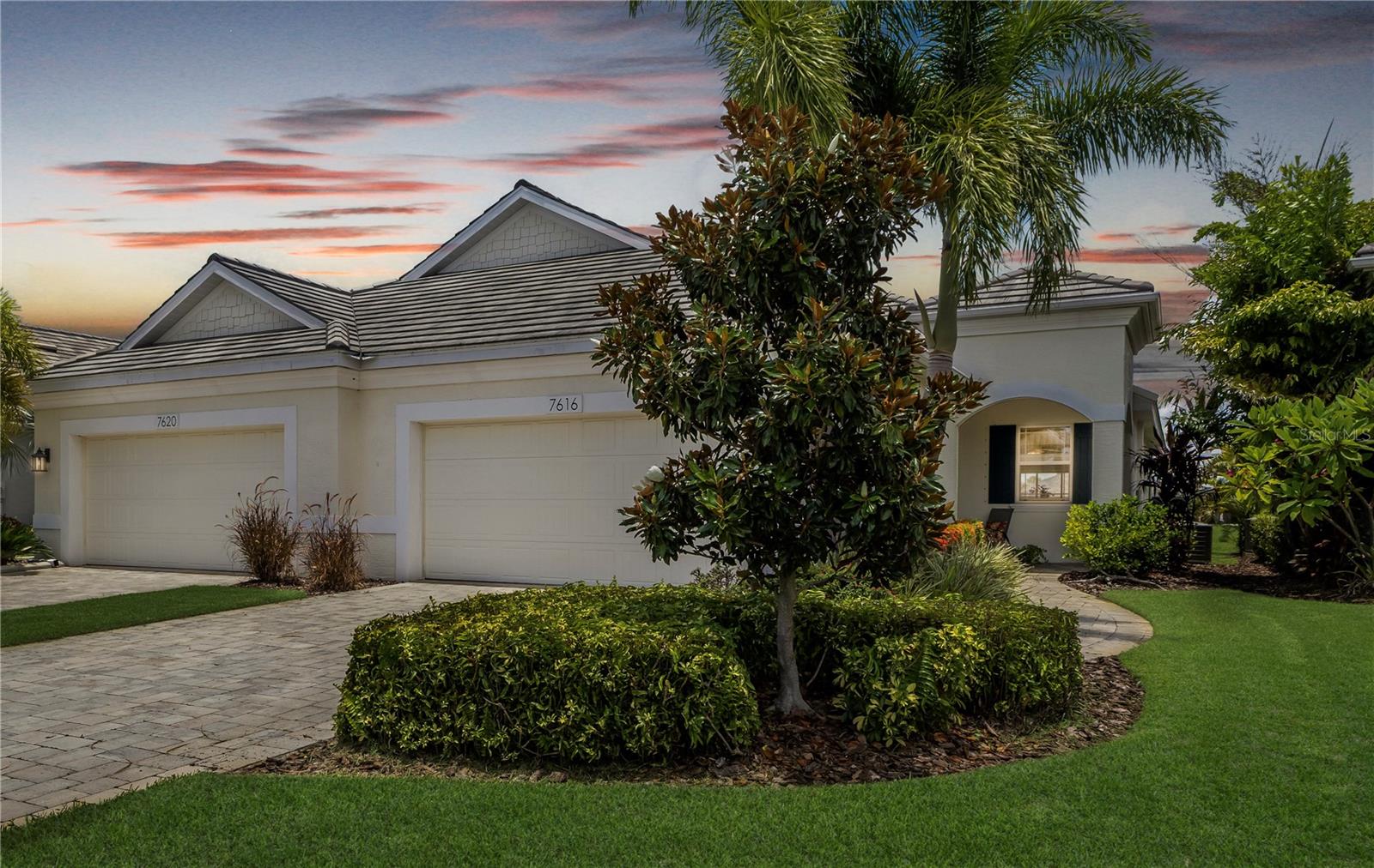 Welcome to University Village, a gated and maintenance-free community conveniently located near the top attractions in Sarasota and Bradenton. Don’t miss the opportunity to own this immaculately maintained villa with a stunning lake view. This villa features an open floor plan that is ideal for entertaining guests. The kitchen is equipped with wooden cabinets, granite countertops, and a spacious island, perfect for food preparation and additional seating. The split-bedroom layout ensures privacy for everyone, while the owner's retreat includes a large picture window, a walk-in closet, and a private bathroom with dual vanities, a walk-in shower, and a water closet. Experience Florida's enchanting outdoor living in this villa! The welcoming covered entry provides additional seating or a haven for plant lovers. Step through the large sliding glass doors into the serene screened lanai, which boasts a lovely lake view and ample space for a grill and comfortable loungers—ideal for relaxation or entertaining. Additional features of this home include hurricane shutters, a separate interior laundry room, a two-car garage, a paver driveway, a tile roof, and custom window treatments. The villa is ideally located within the community, just steps away from the community pool, spa, and dog park. University Village is only minutes from downtown, UTC Mall, the airport, I-75, beautiful beaches, parks, and world-class golf courses. This home is the perfect place to call your own!