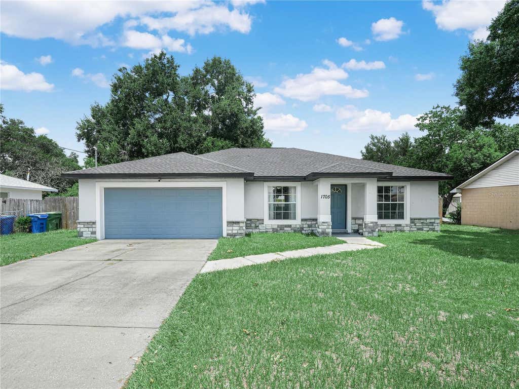 Photo of 1705 Sandalwood Circle SW, Winter Haven, FL 33880 (MLS # P4939364)
