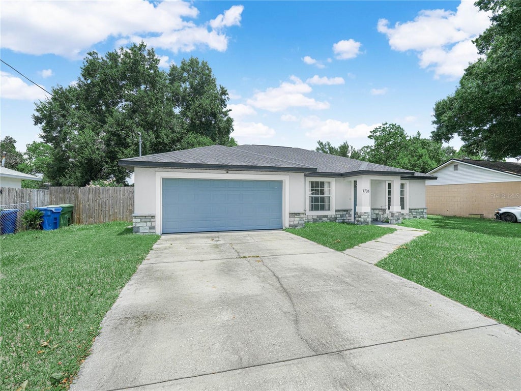 Photo of 1705 Sandalwood Circle SW, Winter Haven, FL 33880 (MLS # P4939364)