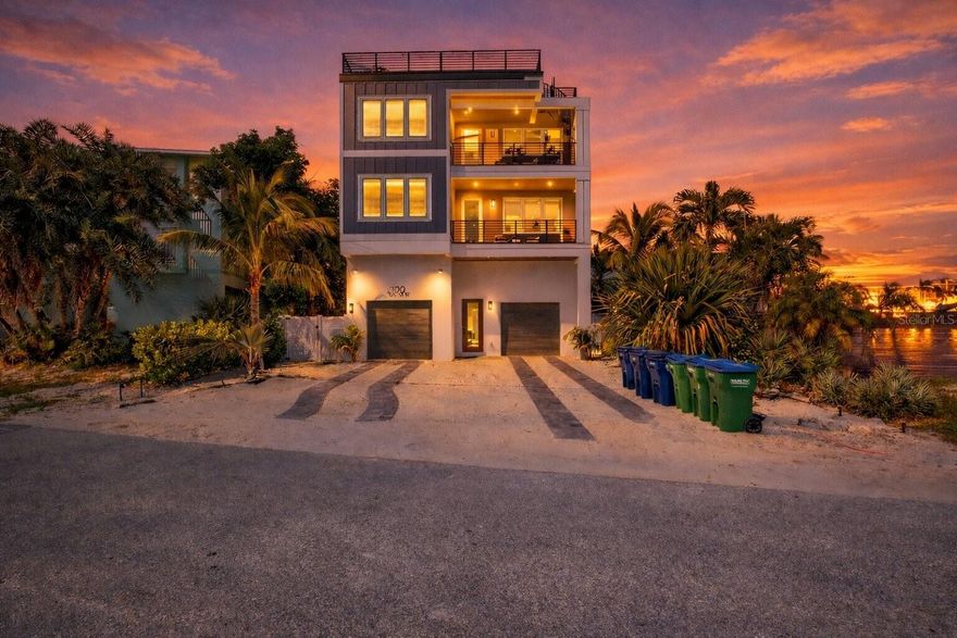 Welcome to your island escape in the highly sought-after Bradenton Beach area of Anna Maria Island - just steps from the sugar-white sands and turquoise waters of the Gulf. Perfectly positioned within a short stroll to the iconic Bridge Street Pier, vibrant bars, boutique shops, and top-rated restaurants on Bridge Street, this custom-built luxury home offers the ultimate blend of location, lifestyle, and income potential. This stunning 6-bedroom, 6.5-bathroom pool home was thoughtfully designed for both comfort and entertaining. The open-concept living area showcases high-end finishes, abundant natural light, and seamless indoor-outdoor flow. Step outside to your private tropical oasis, complete with a heated saltwater pool and spa, surrounded by generous outdoor lounging space - perfect for relaxing after a day at the beach or unwinding under the stars. Take in breathtaking island sunsets from the expansive rooftop terrace, offering panoramic views and the perfect setting for evening gatherings. Additional highlights include a 3-car garage, ample storage, and premium craftsmanship throughout. Currently operating as a successful vacation rental, this property offers excellent investment potential and can be sold fully furnished for a seamless turnkey opportunity. Whether you're seeking a luxury primary residence, second home, or income-producing coastal retreat, this exceptional Anna Maria Island property delivers the best of island living - just steps from the beach and the heart of Bridge Street.