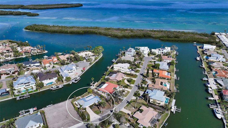 Check out the new photos in the photo gallery. Beautiful waterfront home in the highly sought-after neighborhood of Emerald Harbor on north Longboat Key! A beautiful boating community with wide, deep-water canals with easy access to the intercoastal and Cannon’s Marina. This particular property has a one-story three-bedroom pool home with approximately 2,200 SF of living space located on an oversized 15,000 SF lot. It had some water intrusion for the first time from Hurricane Helene but has been professionally remediated and is ready for renovation. The home has a newer metal roof (2021), a newer A/C (2023) and a 30 ft pool. Another option is to build your dream home on this large lot to take advantage of the intercoastal water views. Emerald Harbor has its own deeded beach access across the street on Gulf of Mexico Drive. Close to many new restaurants and shops.