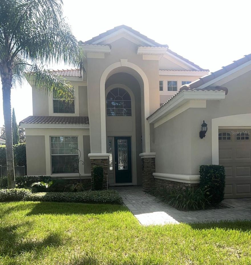 Beautiful 2-story home featuring 5 bedrooms plus a bonus room and 3.5 bathrooms in the gated Meadow Ridge community. The home showcases scraped hardwood floors throughout the foyer, great room, dining areas, and hallways. The spacious kitchen opens to the great room and includes granite countertops, stainless steel appliances with double oven, abundant cabinetry, a breakfast bar, and a large dining area.
The first-floor master suite offers crown molding, a large walk-in closet with center island, and a luxurious bathroom with granite counters, dual sinks, a garden tub, and separate walk-in shower. Upstairs you’ll find four additional bedrooms, a bonus room, and two bathrooms with granite finishes.
Enjoy outdoor living on the screened lanai with brick pavers, along with a paver driveway and walkway. Additional features include a spacious laundry room with utility sink.
Located in the gated Meadow Ridge neighborhood, close to shopping, dining, major highways, and attractions. Community amenities include a pool and playground.