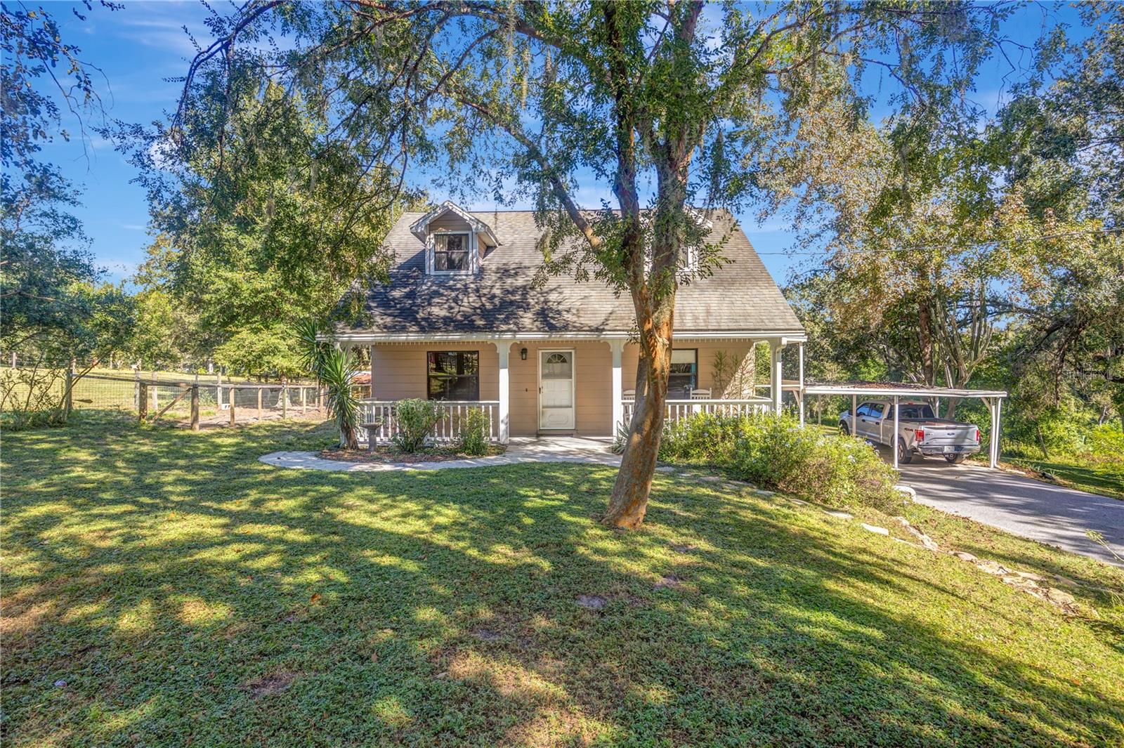 Rustic charm on 6.41 acres with creek views and a huge workshop! Welcome to 33125 Saint Joe Road in beautiful Dade City. This inviting 3-bedroom, 2.5-bath home sits on over 6 peaceful acres, offering the perfect blend of country living and rustic charm. Enjoy the sound of the creek babbling, streaming right on the property and plenty of space to relax and unwind surrounded by nature. Inside you'll find cozy living spaces filled with natural light and warm, country character throughout. This property also features a huge workshop with electricity - perfect for hobbies, storage, or running a small business from home. Located just a short drive from downtown Dade City, you'll have the convenience of local shops and restaurants close by while still enjoying the peace and privacy of country living. Come see this beautiful home in person. Schedule a visit today.