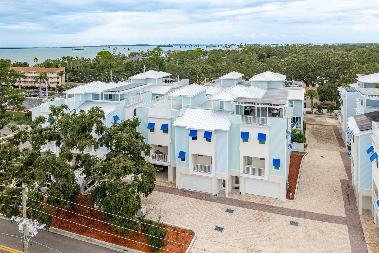 Introducing Mira Vista Townhomes – Final Opportunity to Own Dunedin's Coastal Gem. Welcome to Mira Vista Townhomes, where luxury, location, and lasting quality come together in Dunedin’s most exclusive coastal enclaves. This is your last chance to own a new 2025 ICF-built residence in this boutique community that allows short-term rentals —a thoughtfully crafted townhome offering elevated design, unparalleled durability, and a lifestyle second to none. Spanning 2,759 square feet across four impressive levels, each home includes a private 4-stop elevator—from the oversized 4-car garage to the showstopping rooftop terrace with breath-taking views of Clearwater Beach, Caladesi Island and the Intracoastal Waterway. Modern Living, Elevated | The second-floor main living space features 10-foot ceilings, smooth-finish walls and ceilings, and designer-engineered wood flooring throughout. An expansive great room flows seamlessly into a spacious dining area and a gourmet kitchen equipped with premium granite countertops, walk-in pantry, gas range on the center island, real wood shaker cabinetry, and upgraded stainless appliances. Two balconies, a stylish half bath, and a dedicated home office/flex space complete this sunlit level.
Private Quarters | The third level hosts the owner’s retreat, complete with walk-in closet, spa-like bath featuring a frameless walk-in shower, soaking tub, dual vanities, and water closet. Two additional bedrooms, a full bath, and a centrally located laundry area offer comfort and convenience for family or guests. Rooftop Views & Outdoor Living | Up top, your private rooftop terrace invites you to entertain, unwind, or sunbathe with breathtaking coastal vistas and sunset panoramas over the Gulf—an unmatched escape in the heart of Dunedin. Built to Endure | Constructed using Insulated Concrete Forms (ICF), Mira Vista homes deliver superior hurricane protection (235 mph wind rating), top-tier energy efficiency, exceptional soundproofing, and natural resistance to mold, termites, and moisture—making it one of the most resilient home designs on the market today. Additional upgrades include Miami-Dade rated impact windows and doors, 8' solid-core interior doors, LED lighting, Hardie siding, and super gutters. A Private Coastal Community | Mira Vista is ideally located along the Pinellas Trail, just a short walk or bike ride to downtown Dunedin, Caladesi & Honeymoon Islands, and nearby restaurants, marinas, and tiki bars—including the vibrant waterfront at Marker 8. The community's private paved street, nautical architecture, and Florida Smart Water landscaping blend seamlessly into Dunedin’s charming coastal aesthetic. Each residence owns their land and has a quaint yard for entertaining or pets to roam. Only One Home Remains!! This is your final opportunity to own a new 2025 luxury Mira Vista Townhome. With no detail overlooked, Mira Vista sets a new standard for townhome living in Pinellas County. Schedule your private tour today—before this rare offering is gone.