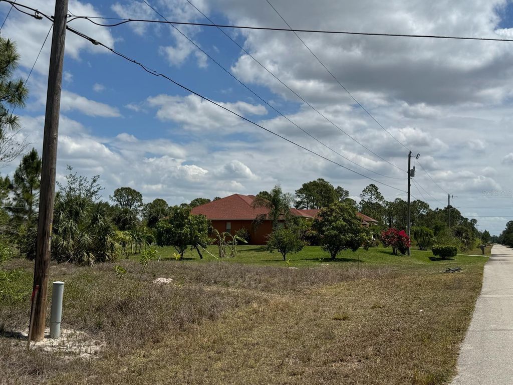 Photo of 513 Addison Street E, Lehigh Acres, FL 33974 (MLS # O6304387)