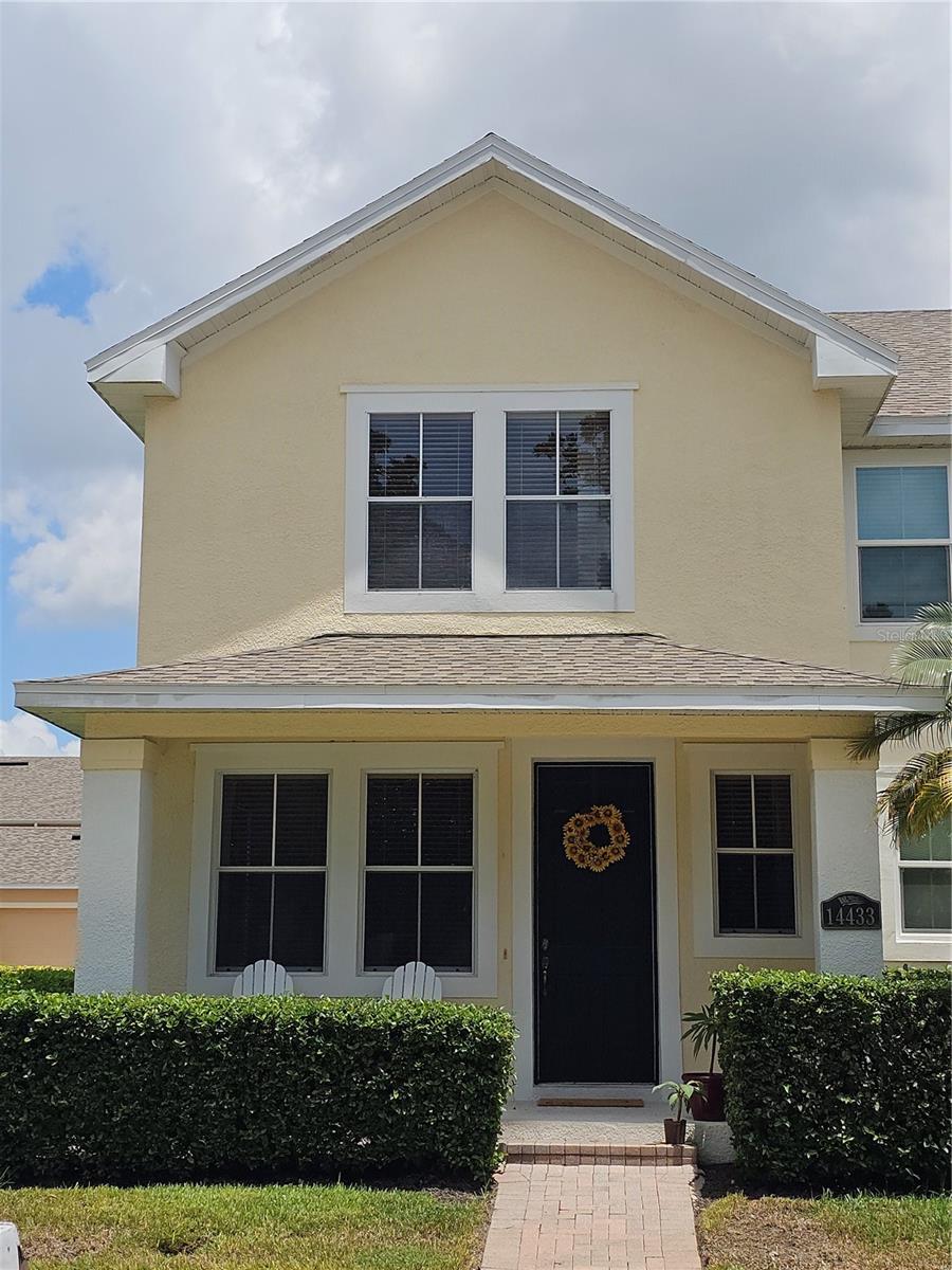 Welcome Home to this beautiful 3-bedroom, 2.5-bathroom townhome located in the highly sought-after Independence community! This neighborhood is known for its world-class amenities and strong community atmosphere! Open the door to a formal dining or sitting room with beautiful wood flooring filled with natural light. The open kitchen includes stainless steel appliances, bar-top seating, and large tile flooring. The living room connects you to your outside private, fenced backyard, perfect for relaxing, grilling out, pets, and easy access to the detached two-car garage. Upstairs, you’ll find wood floors throughout, along with all three spacious bedrooms, two full bathrooms, and a convenient laundry closet. As a end unit, coupled with the park directly across the street the home offers you more green space and privacy. Home has brand new AC (2025), New Water Heater (2025), New Smoke decors (2025), and New water efficient toilets in the the bathrooms (2025). Residents enjoy access to two resort-style pools, two fully equipped fitness centers, tennis and basketball courts, and over six miles of bike and walking trails. Beautiful parks, green spaces, and two private lakes with boat ramps provide serene spots for relaxation and water activities. A dedicated Lifestyle Team organizes exciting community events throughout the year, including seasonal festivals, fireworks displays, and food truck gatherings, fostering a vibrant and connected neighborhood. Situated just minutes from Disney and top Orlando attractions, with easy access to Hwy 429 and the Florida Turnpike, this home offers convenience, entertainment, and a true sense of community. The HOA fee covers high-speed internet, cable, exterior paint, roof replacement when needed, exterior and interior pest control, and landscaping maintenance. A must see!
