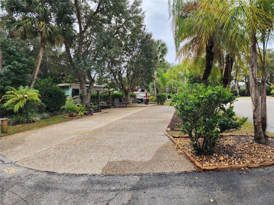 Exquisite Corner Lot in Phase 4: Your Ultimate RV Oasis. Welcome to the epitome of luxury RV living! This exceptional corner lot, strategically located next to the Phase 4 pool, laundry facilities, showers, and restrooms, offers an unparalleled blend of convenience and tranquility. Immerse yourself in the harmonious charm of this spacious lot, featuring a Chattahoochee pad and mature landscaping, providing shade and beauty in every direction. Property Sale includes Wooden Swing, Firepit, and Outdoor Dining Set Complete with Umbrella. Abundant Space: Enjoy the expansive space that this corner lot provides, offering endless possibilities for outdoor living, entertaining, and relaxation. Mature Landscaping: Experience the natural beauty of mature landscaping that adorns this lot, providing shade, privacy, and a picturesque backdrop to your RV retreat. Seize the opportunity to own this extraordinary property, where luxury meets convenience. Investment opportunity! Contact us today to schedule a private viewing and envision the possibilities of making this prime RV lot your own. Lot Purchase Requires a 1x Capital Contribution Fee in the Amount of $1,750.00 paid to the HOA at Closing; 
Note: All information deemed reliable but not guaranteed. Buyer to verify. ***Seller is a Licensed Real Estate Professional***