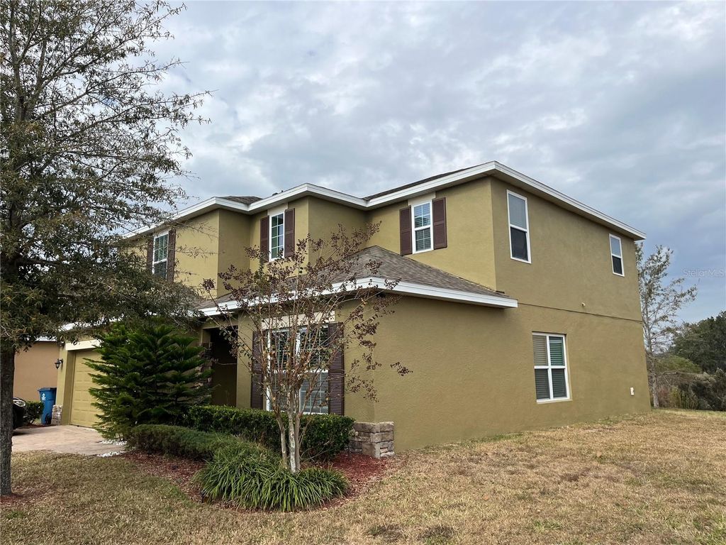 Photo of 1234 Andalusia Loop, Davenport, FL 33837 (MLS # O6363396)