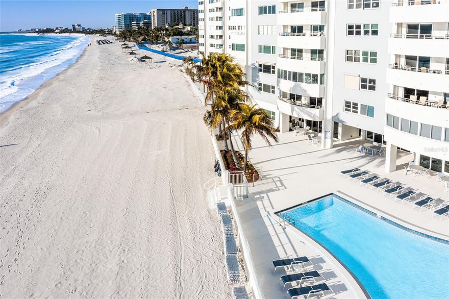 ****There is nothing left to do. Nothing to imagine. Completed in 2022, everything has been upgraded and transformed into the most modern luxury. This high-floor corner residence on Lido Beach in the Key South Tower building has been completely transformed—from ceilings to floors—into a home where every high-end creature comfort is already in place and water views unfold from every window. The building is so modern, so perfectly updated and completed that it even has its own hurricane/surge protection system surrounding the building-- unique and impressive. You must see this condo's extraordinary views in day and at night!!! 

****Panoramic vistas stretch across the Gulf of Mexico, Sarasota Bay, the Ringling Bridge, and downtown Sarasota, creating a constantly shifting backdrop of light, water, and skyline. Set within a Lido Beach building that has already been elevated to the highest modern building standards, this residence offers peace of mind. The HOA’s abundant reserves reinforce the sense of security -- owners love living here.
Inside, porcelain tile flows throughout, complemented by all-new ceilings and modern lighting that set a sophisticated, contemporary tone.

****The kitchen is both elegant and functional, featuring abundant new wood cabinetry, quartz countertops, and new appliances—designed for everything from casual mornings to elevated entertaining. The primary suite is a private sanctuary, framed by water views and finished with the finest luxury tile. It offers a walk-in closet, an ensuite bath with a walk-in shower, and thoughtful storage. The guest suite is equally impressive, with new tile, a walk-in closet, and beautiful views of the Intracoastal Waterway and downtown Sarasota. Spacious enough for a king bed, it also features its own walk-in shower, making it ideal for guests who appreciate comfort and privacy.

****Beyond the residence, Key Tower South has been fully reimagined, with the lobby and common areas completely renovated in 2025. Residents enjoy 220 feet of private Gulf frontage, a heated beachfront pool, expansive sundeck, direct beach access, saunas, a fitness room, library, bike storage, and on-site management—resort-level amenities without the crowds.

****This is not simply a condo. It is a fully realized beachfront lifestyle—elegant, effortless, and complete. Call now for a private showing. Prefer to experience it from afar?  Drone footage and immersive fly-throughs are available.