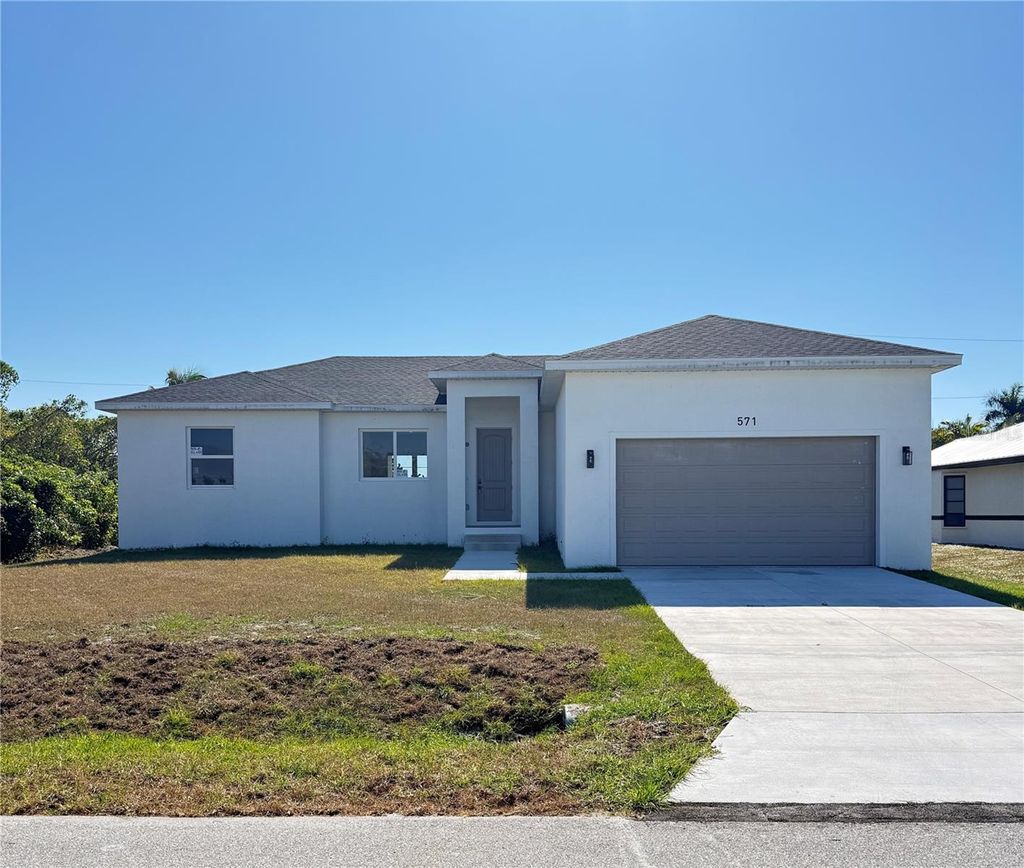 Photo of 571 Mimosa Avenue NW, Port Charlotte, FL 33952 (MLS # A4672465)