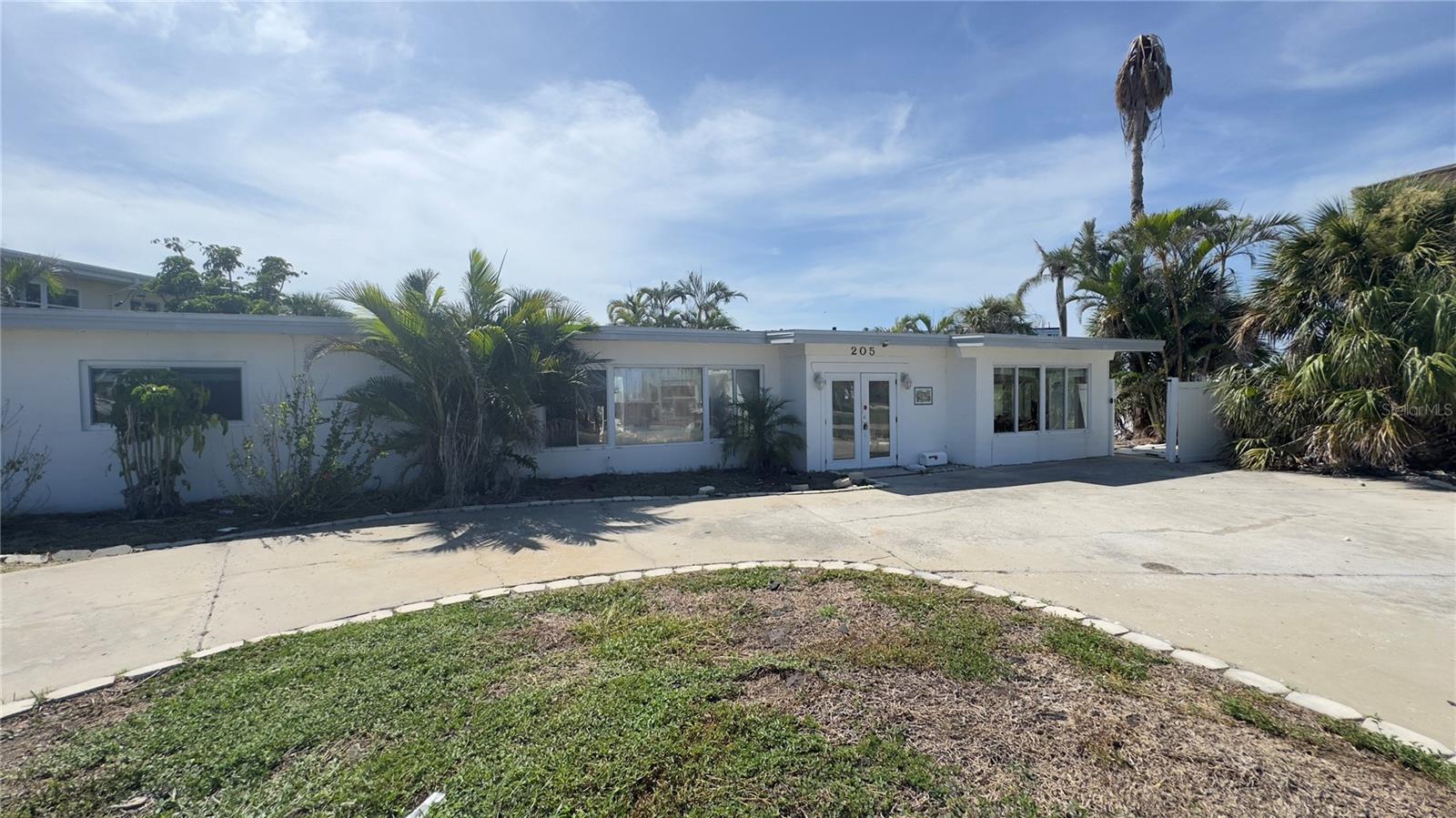 Exceptional opportunity to create a custom luxury estate just steps from the pristine sands of St. Pete Beach. This prime lot at 205 55th Ave offers the perfect canvas to design your dream coastal home. Although the existing structure was impacted by a recent hurricane, the true value lies in the land and its unbeatable location—walkable to the beach, fine dining, and vibrant local culture. Seize this rare chance to build in one of Florida’s most coveted beachside enclaves.