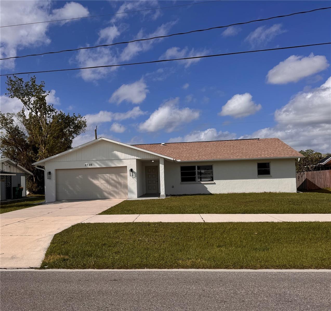 BRAND NEW ROOF IN 2024, 3 BEDROOM 2 BATH, 2 CAR GARAGE, NEW FLOORING, NEW CARPETING, NEW BATHROOM VANITYIES, SPACIOUS KITCHEN FEATURES STAINLESS STEEL APPLIANCES, MODERN WASHER AND DRYER, LARGE LIVING ROOM AND FAMILY ROOM . NEWER A/C. PRIME LOCATION CENTRALLY LOCATED WALKING DISTANCE TO PHARMACY, SHOPPING CENTERS AND RESTAURANTS. MINUTES TO PORT CHARLOTTE HARBOR AND NEW SUN SEEKER RESORT.