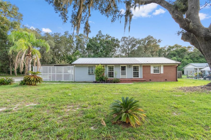 Short Sale. Welcome home to the heart of Keystone Heights, just two blocks away from admired schools and outdoor paradise. This home is 4 beds and 2 baths, featuring a large screened in back porch and wooden deck. The lot is completely fenced in with mature trees and landscaping and a two car carport. On the interior, you will find wood and tile throughout the home, plenty of kitchen counter space, and spacious bedrooms. This home provides both indoor comfort and outdoor play. Schedule a tour today!