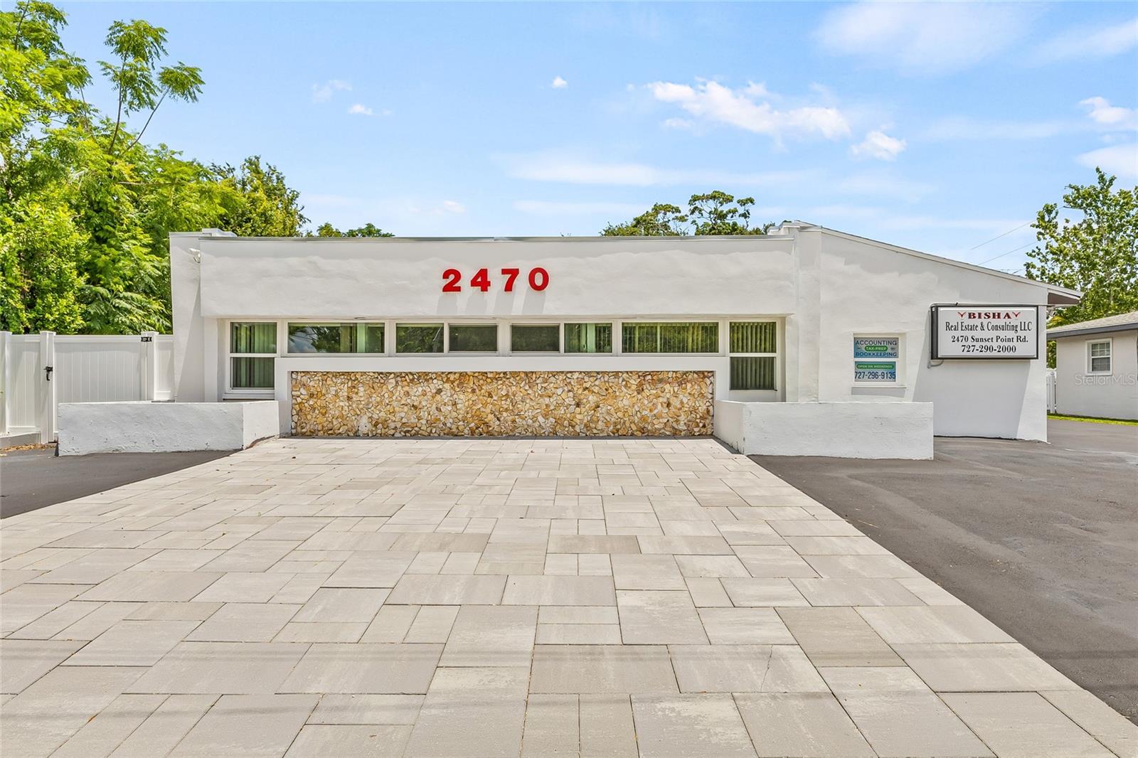 Location, Location! Excellent Visibility from Sunset Point. STAND ALONE. NO FLOOD ZONE. No Evacuation Zone. Centrally located 2 blocks from US Highway 19 N. Great visibility. Building offers: WATING AREA AS YOU WALKING FURNISHED AND SMART TV. Building includes, reception area, 5 separate offices, full operating kitchen along with new dishwasher, 1 Guest and 1 full bathroom with shower, additional large storage room including latest stackable smart washer and dryer for convenience. ADA compliant. Conference room comes all furnished along with 65-inch smart TV. Free Standing 1870 Heated square feet. NEW ROOF and FLAT ROOF NOVEMBER 2024, ASPHALT 2024, ASPHALT SEALCOATING 2025. FLAT ROOF A/C DECEMBER 2024, FRONT BUILDING WINDOWS DECEMBER 2024. FULLY EQUIPED KITCHEN JANUARY 2025, SMART DISHWASHER, JANUARY 2025, BATHROOM 2025, FENCE JANUARY 2025. ELECTRIC BOX 2025. WASHER & DRYER LG BRAND 2025 with SMART FEATURES, BACKYARD TILED WITH A SEPERATE SMOKING AREA. GUEST AREA BY THE FRONT FDOOR FOR GUEST TO RELAX. WATING AREA AS YOU WALKING FURNISHED AND SMART TV . Office offers 2 bathrooms. Conference room comes all furnished along with 65-inch smart TV. 12 parking spaces on the back. Place your business name on the building. 2 LED SIGNANGE visible at night with led lights. ZONED GENERAL OFFICE (PREVIOSELY MEDICAL OFFICE, ATTORNEY OFFICE, TITILE COMPANY OFFICE).