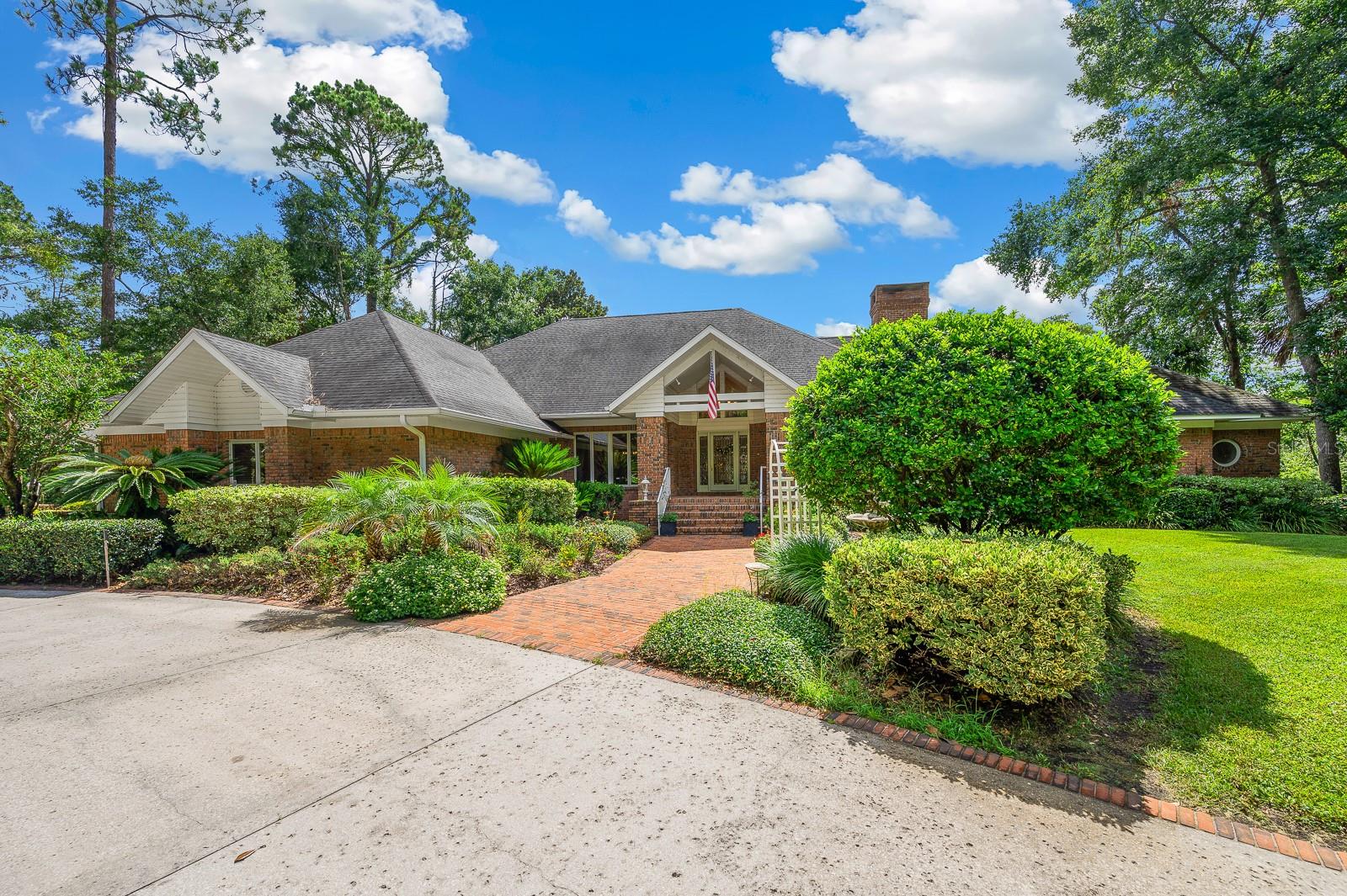 Enjoy the best of lakefront living! This beautifully designed 3-bedroom, 2.5-bath custom brick home is perfectly situated on 4.24 acres with incredible views of privately owned Lake Jeffrey. From the moment you arrive, you'll be captivated by the serene setting, with multiple docks—ideal for swimming, fishing, boating, or simply soaking in the peaceful surroundings.
Inside, you'll find over 3,800 sq ft of thoughtfully designed space with soaring ceilings, hardwood floors, and expansive windows showcasing uninterrupted lake views. The gourmet kitchen features granite counters, custom cabinetry, a large pantry, and flows into the formal dining and living areas. Enjoy both a formal living room and a family room with a wet bar and wood-burning fireplace.
The oversized primary suite features walk-in closets, a stylish en-suite bath, and a private wet bar. A dedicated home office sits just outside the primary providing a private workspace. Additional areas include an upstairs bonus room, climate-controlled garage, and a detached gym with loft and storage.
This property offers stunning lake views and an exceptional outdoor living experience. The thoughtfully landscaped grounds include multiple trex docks and sitting areas, a covered gazebo on the boat dock, and a peaceful swing beneath the tiered dock leading to the water’s edge. Entertain around the custom fire pit or enjoy the grilling area overlooking the lake. A flowing waterfall winds from the upper patio along a slate path to a koi-ready pond, adding a serene touch to the tranquil setting. Every element is designed to elevate the experience.
This is not just a home—it’s a retreat.