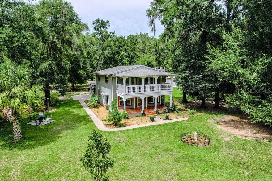 Welcome to your Florida countryside dream home! A beautifully updated 4-bedroom, 2-bathroom modern farmhouse offering 2,865 sq ft of comfortable living on 5 fully fenced acres.
Inside, you’ll love the bright, open layout with luxury tile flooring, a striking stone wood-burning fireplace in the spacious great room, and seamless flow into the formal dining area. The chef’s kitchen features granite countertops, stainless steel appliances, and a large breakfast bar. The main level includes a versatile guest bedroom/office and a convenient laundry/mudroom with side entry.
Upstairs, the oversized 15x30 master suite boasts a private 10x25 balcony overlooking your peaceful acreage.
This home also offers excellent multi-generational living potential: the attached garage is already built out as a large bonus space, simply add a bathroom to create a fantastic private mother-in-law suite or additional living quarters.
Outside, the property shines with a massive 30x60 metal barn (1,800 sq ft) with sealed concrete floor and electric, a 12x12 horse stall, a 20x20 heavy-duty carport, chicken coops, garden areas, fruit trees, and fully fenced pasture with irrigation.
Just minutes from Inverness and Brooksville — yet convenient to Tampa and Orlando — this move-in-ready home delivers the perfect blend of rustic charm, modern comfort, and country lifestyle with high-speed internet already in place.
If you’ve been searching for space, serenity, style, and flexible living options on acreage, this is it. Schedule your private tour today!