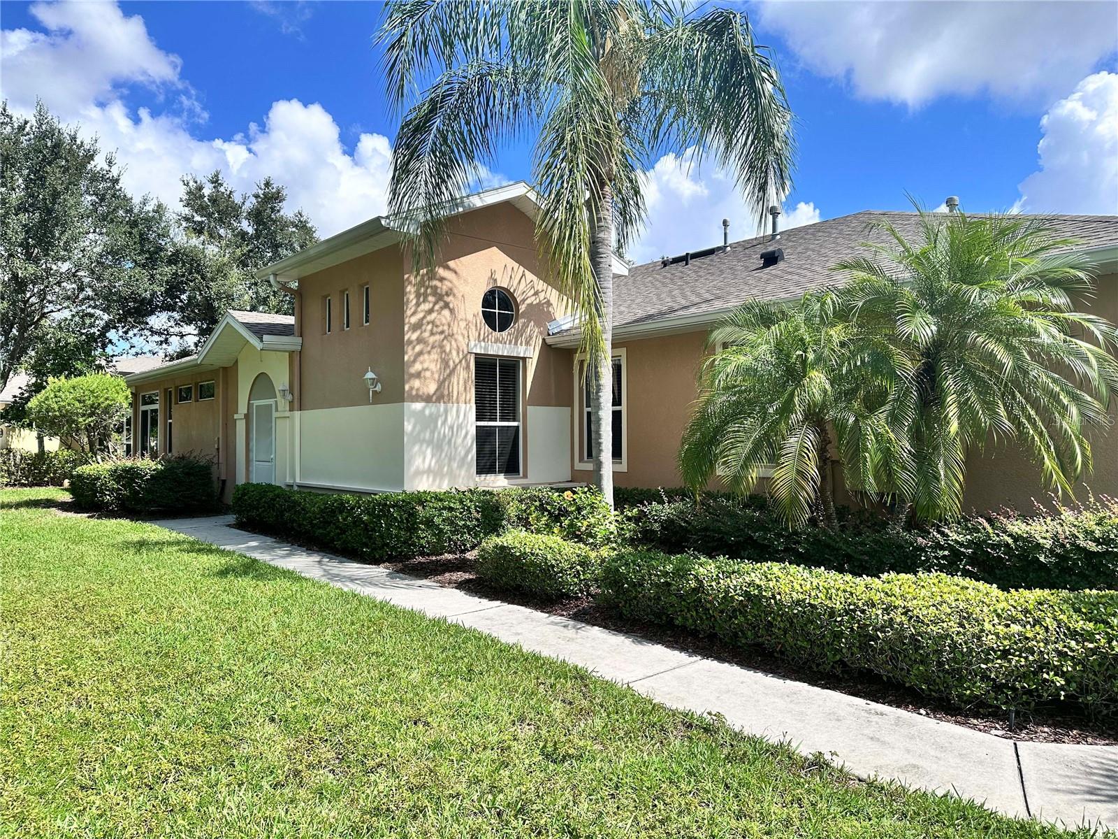 Resort style living at its best in this light and bright Strathaven Model condo located in the highly desired community of Kings Point. This home is located in a pet friendly COA--1 pet with no weight limit! On a corner lot, this home has a huge side yard leading to the front door. Enter and you will see the open floor plan with high ceilings, tile throughout the home (no carpet!), double sliding doors leading to the 208 sqft Florida Room (under air and included in the square footage). This home also features a modern kitchen with 42" wood cabinets and granite countertops, large master bedroom with walk-in closet, updated bathroom, and 2 additional bedrooms. Kings Point is a gated 55+ community with 2 clubhouses, 6 pools, state-of-the-art fitness center, spa, salon, sports bar, pickleball, tennis and over 150 clubs and activities and so much more.