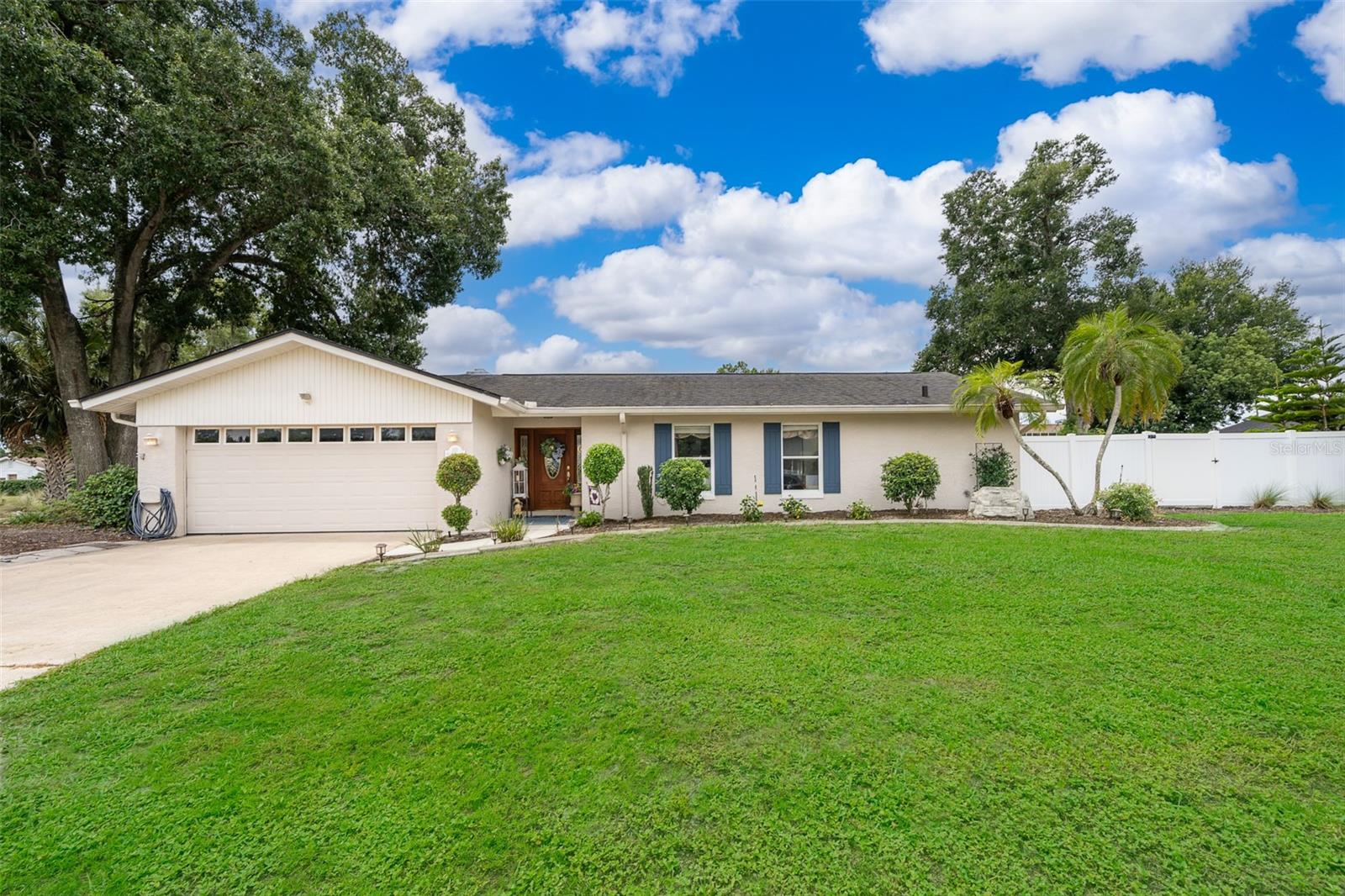 Welcome to this beautifully updated pool home, located in Longwood, FL, tucked away on a quiet corner lot within the highly desirable Woodlands community and the top-rated Seminole County school district. This 4-bedroom, 2-bathroom home offers 1,828 sq. ft. of thoughtfully designed living space and sits on an oversized lot nestled in a cul-de-sac. From the moment you arrive, you’ll appreciate the welcoming curb appeal and classic charm of this well-maintained property. Step inside to discover a bright, open layout filled with natural light, crown molding, recessed lighting, double-pane windows, and a neutral color palette that complements the modern upgrades throughout. The split floor plan offers both functionality and privacy, with wood-look tile flooring that flows seamlessly through the main living areas and bedrooms. The heart of the home is the stylishly updated kitchen, featuring quartz countertops, a gas stove, modern tile backsplash, and sleek cabinetry—all open to the family room and anchored by a cozy wood-burning fireplace and charming ceiling beams overhead. French doors in the formal dining area and sliding glass doors from both the family room and primary suite lead out to the expansive 33’ x 14’ enclosed Florida room, complete with insulated windows and its wall A/C unit—ideal for year-round entertaining or relaxing. The primary suite features a generously sized walk-in closet and an ensuite bath with a walk-in shower. Three additional guest bedrooms are located on the opposite side of the home—two of which include custom closet organizers—all offering ample storage and flexibility for guests, family, or a home office setup. The guest bathroom is well-appointed with dual sinks, a tub/shower combo, and even direct access to the backyard, making it a convenient pool bath as well. Step outside to enjoy your private outdoor retreat, featuring an in-ground saltwater pool & spa, all within a fully screened-in enclosure (rescreened approx. 3 years ago). The backyard also includes a fire pit area with a propane hookup, a built-in propane grill, and a vinyl-fenced yard with plenty of space to entertain, relax, or let pets play. Don’t miss the 16’ x 10’ air-conditioned storage shed—perfect for hobbies, extra storage, or a home gym. Other highlights include a spacious laundry room conveniently located off the garage, a two-car garage with utility sink and side entry door, and recent mechanical upgrades: roof (~14 years old), A/C unit (~6 years old with a new compressor installed ~1 year ago), and water heater (~1 year old). The home is also equipped with an irrigation system. Situated in the tranquil and well-established Woodlands community, you’ll enjoy easy access to local parks, walking trails, and outdoor recreation, as well as nearby shopping, dining, top-rated schools, and major roadways for a quick commute to Orlando and surrounding areas. Don’t miss your opportunity to own this move-in ready Longwood retreat—schedule your private showing today!